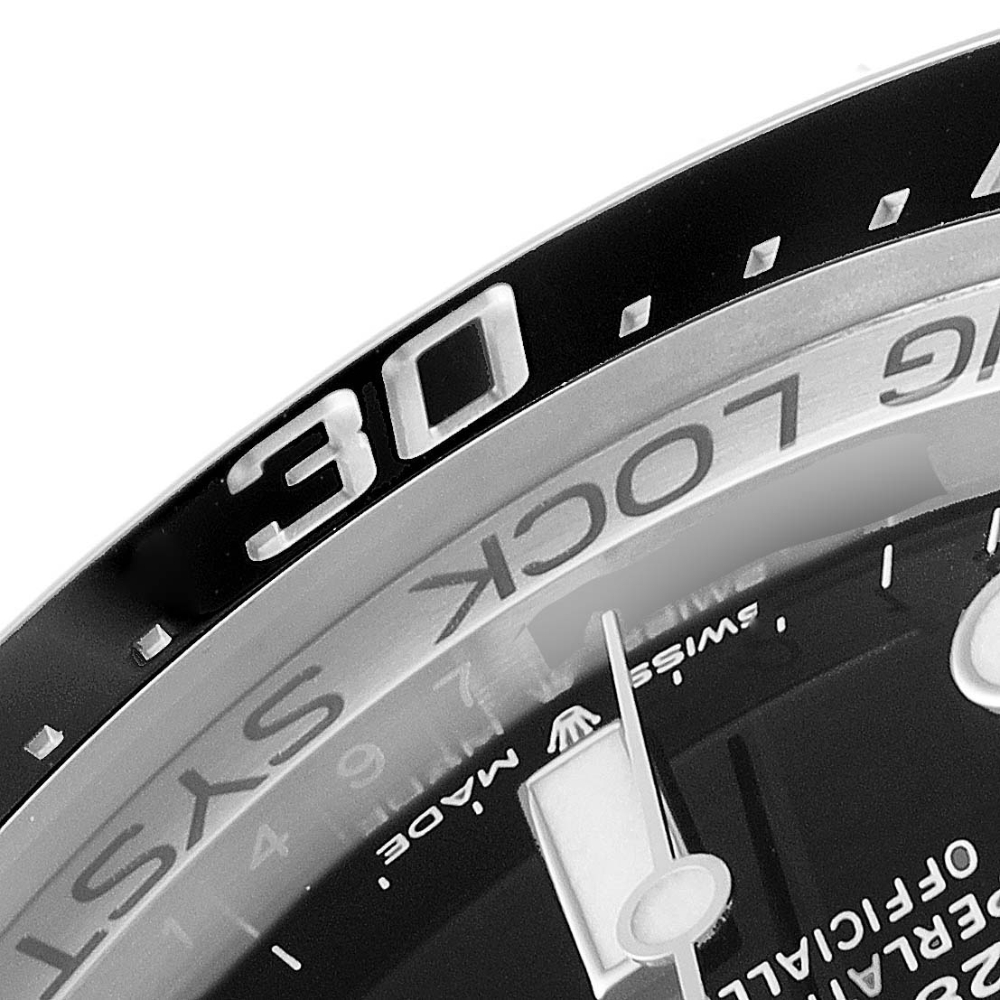 This image shows a close-up of the bezel and part of the dial, specifically the 30-minute marker, of a Rolex Sea-Dweller 126660 Men
s Stainless Steel Blue Dial 126660 Men
s Stainless Steel Blue Dial watch.