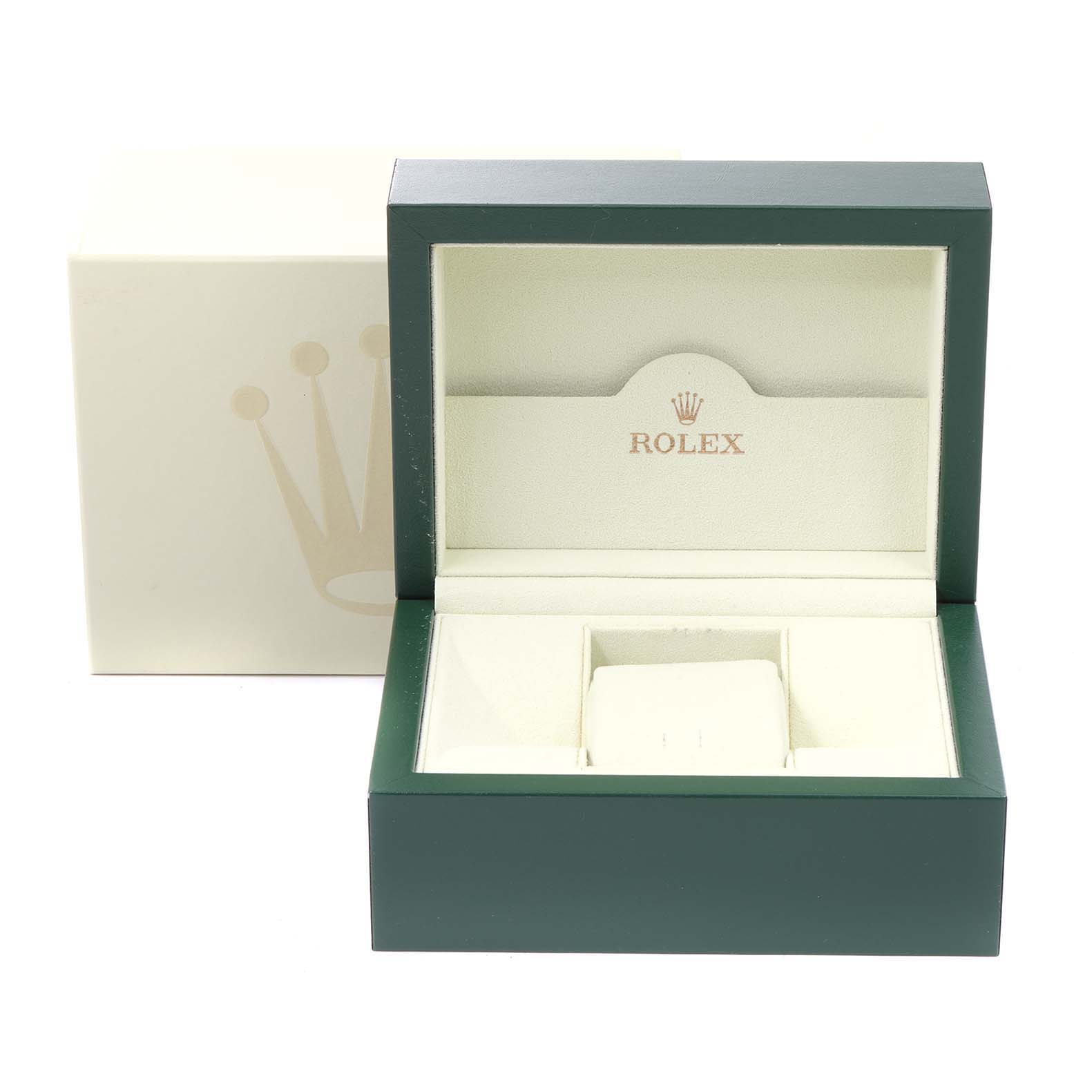 This image shows an open green Rolex watch box for the Submariner model, with an empty cushion and the outer beige box.