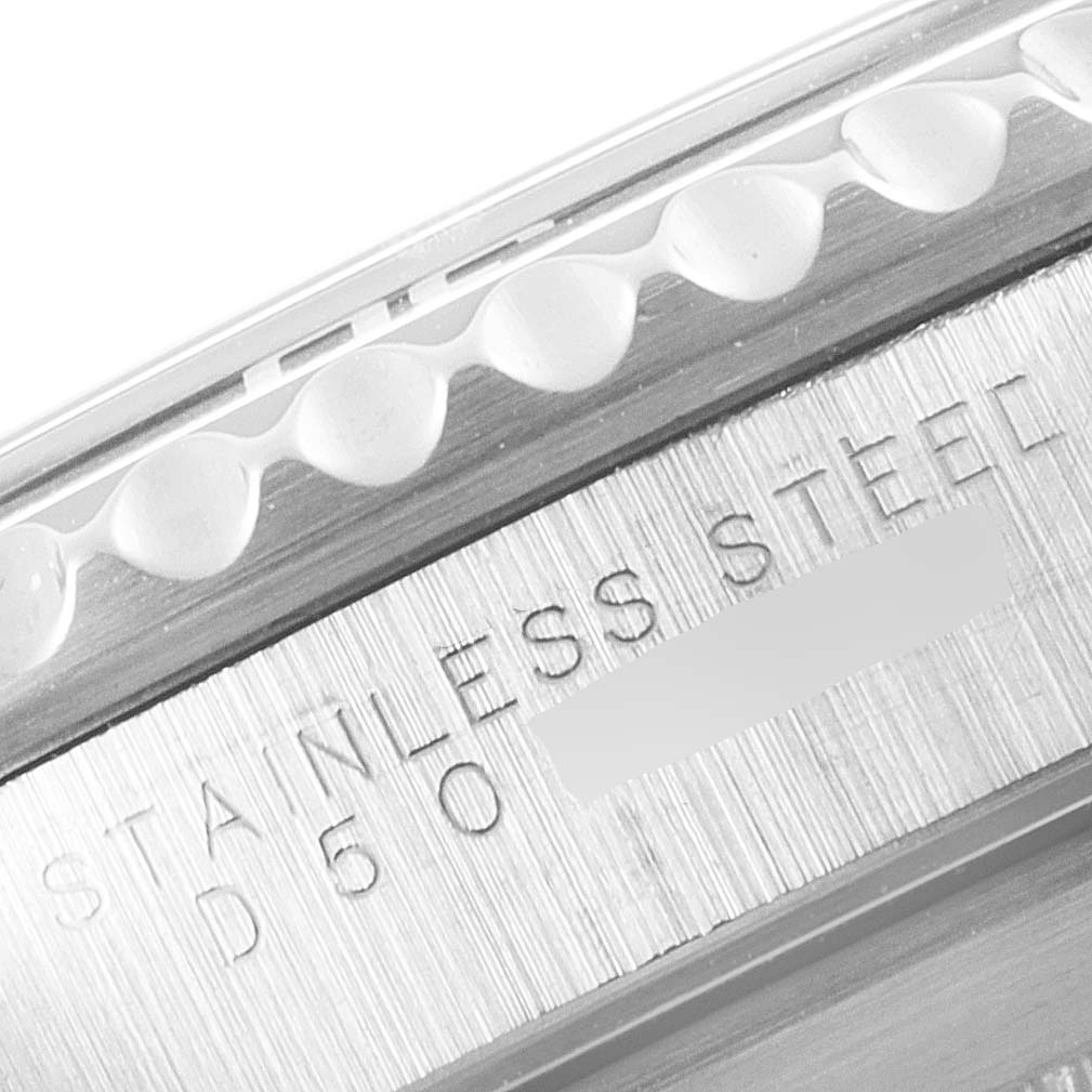 This image shows a close-up of the stainless steel case side and the inscription on a Rolex Submariner 14060 Men
s Stainless Steel Black Dial 14060 Men
s Stainless Steel Black Dial watch.