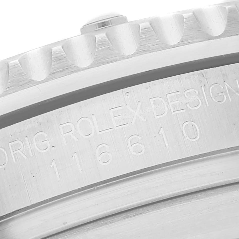 The image shows a close-up of the side engraving and part of the bezel of a Rolex Submariner 116610 Men
s Stainless Steel Black Dial 116610 Men
s Stainless Steel Black Dial model 116610.