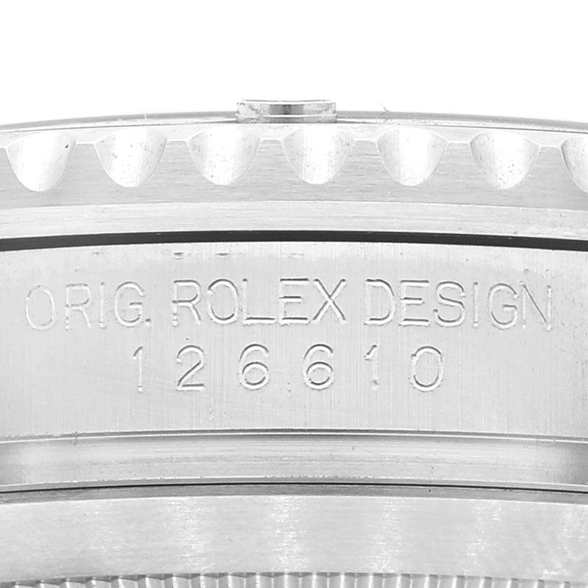 This image shows a close-up of the case side of a Rolex Submariner 126610 Men
s Stainless Steel Black Dial 126610 Men
s Stainless Steel Black Dial, highlighting the model number 126610 and the “ORIG. ROLEX DESIGN” engraving.