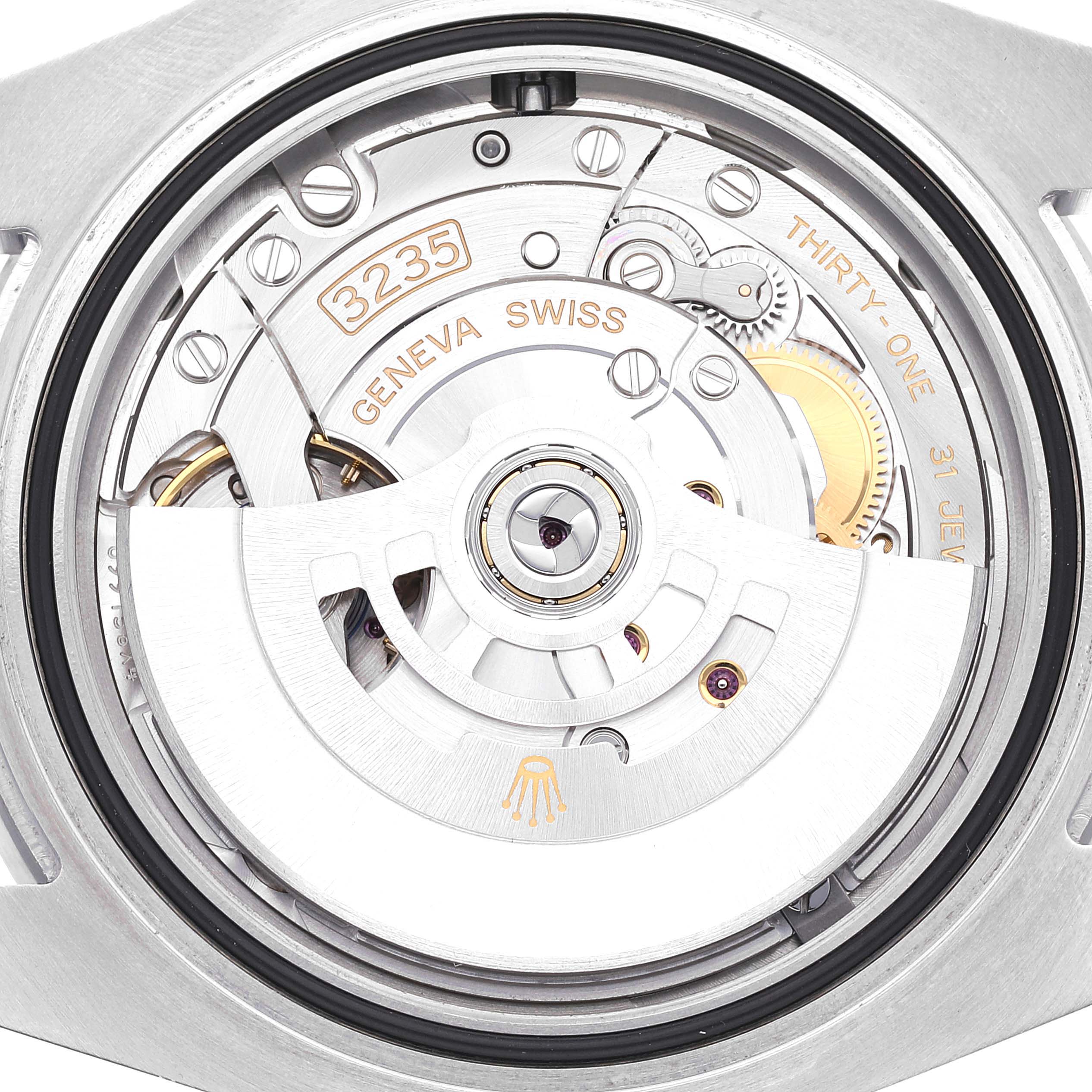 The image shows the movement and intricate internal mechanism of a Rolex Submariner 126610 Men
s Stainless Steel Black Dial 126610 Men
s Stainless Steel Black Dial watch from a top-down view.