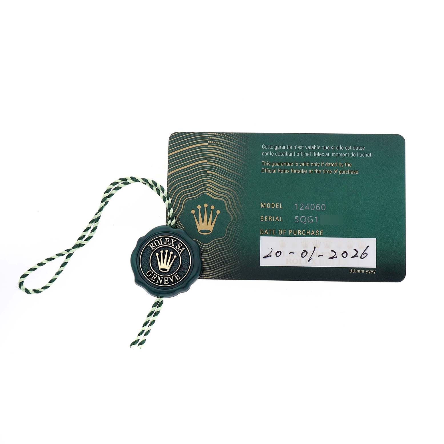 The image shows a Rolex Submariner M124060-0001 Men's Stainless Steel Black Dial model warranty card alongside a Rolex tag.