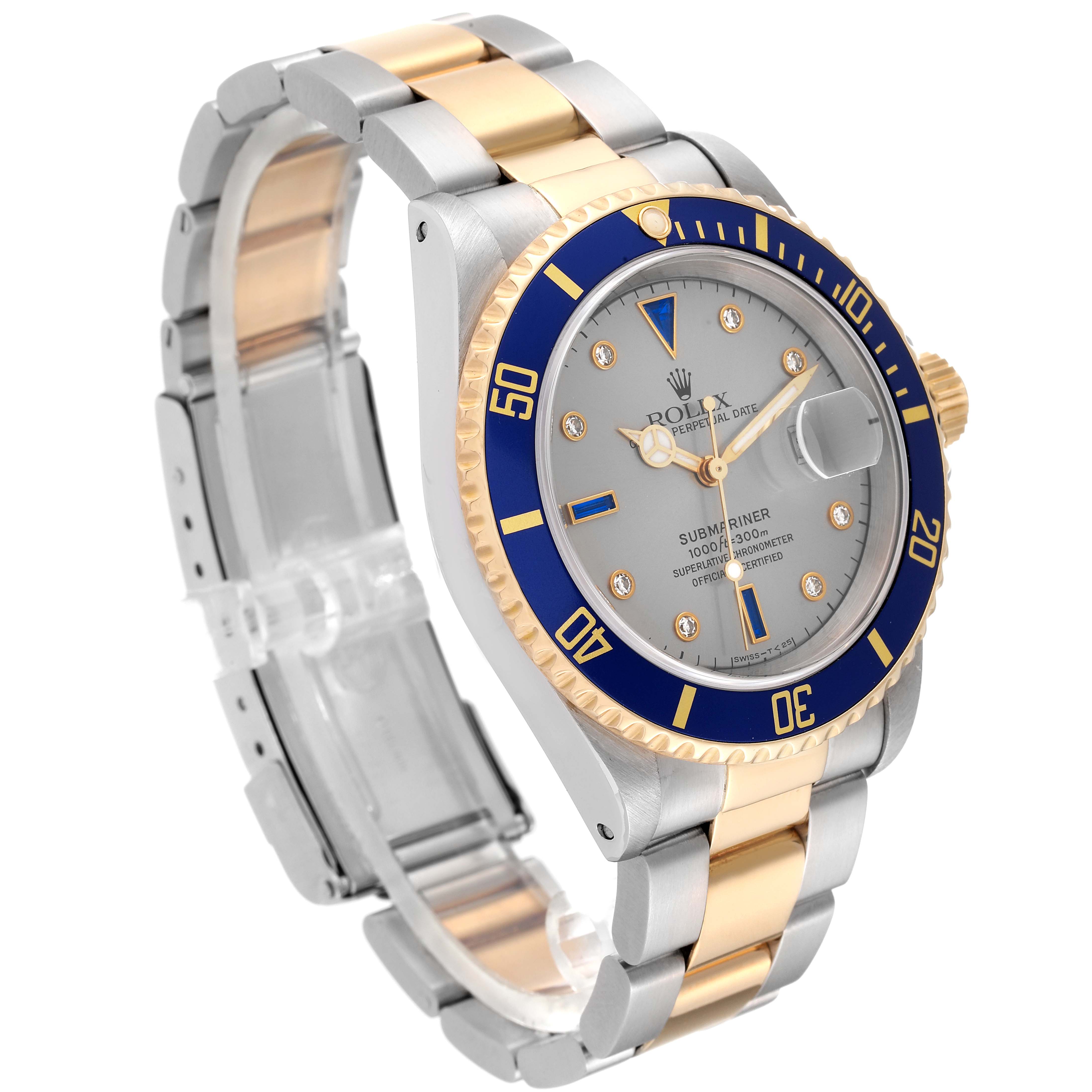 This Rolex Submariner 16613 Men's Steel and Gold (two tone) Grey Dial 16613 Men's Steel and Gold (two tone) Grey Dial watch is shown at a slight angle, displaying its face, bezel, and two-tone metal bracelet.