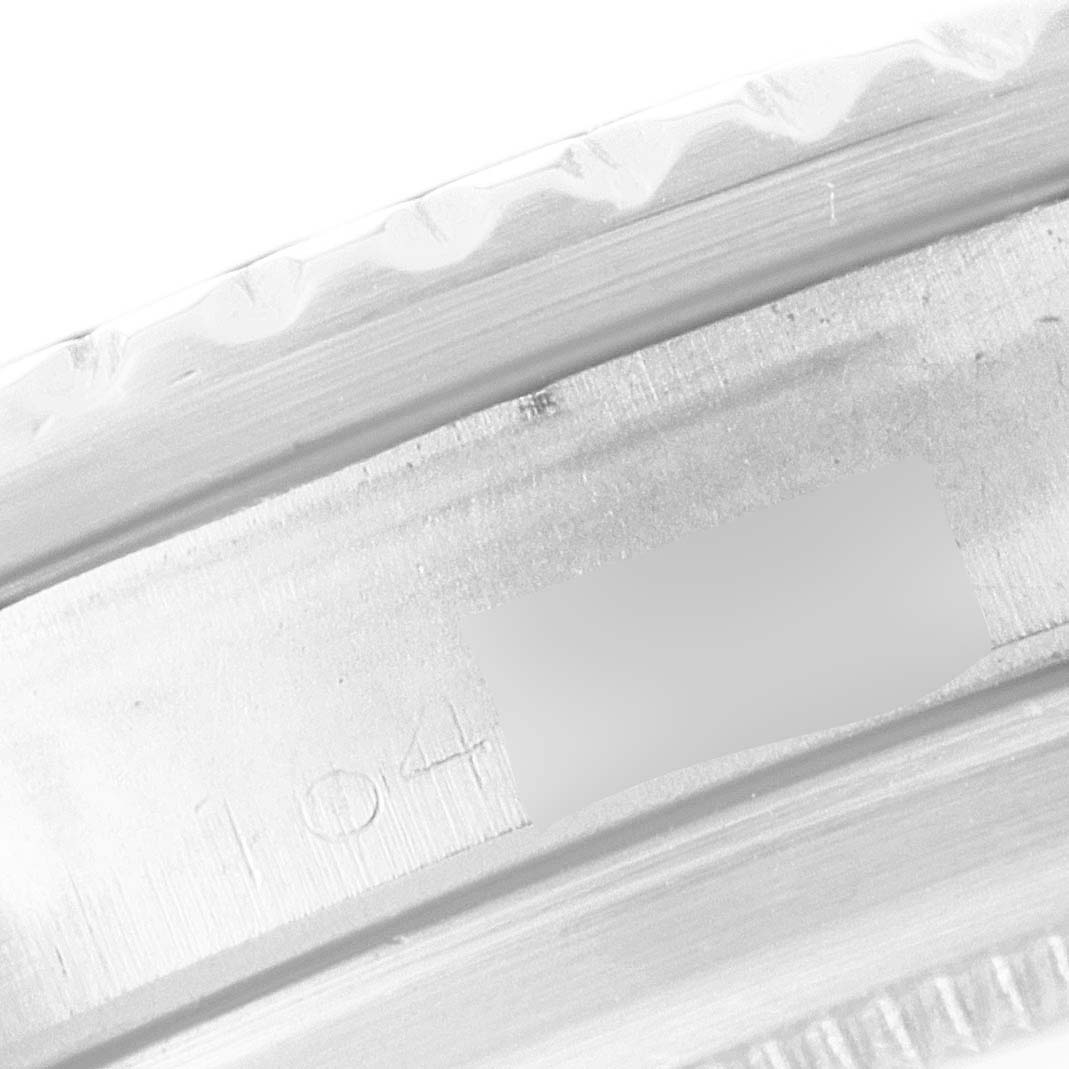 This image shows a close-up of the engraved part on the inner bezel of a Rolex Submariner 5513 Men's Stainless Steel Black Dial 5513 Men's Stainless Steel Black Dial watch.