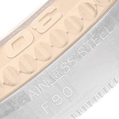 Close-up of the Yacht-Master model by Rolex, focusing on parts of the bezel and the engraving on the case.