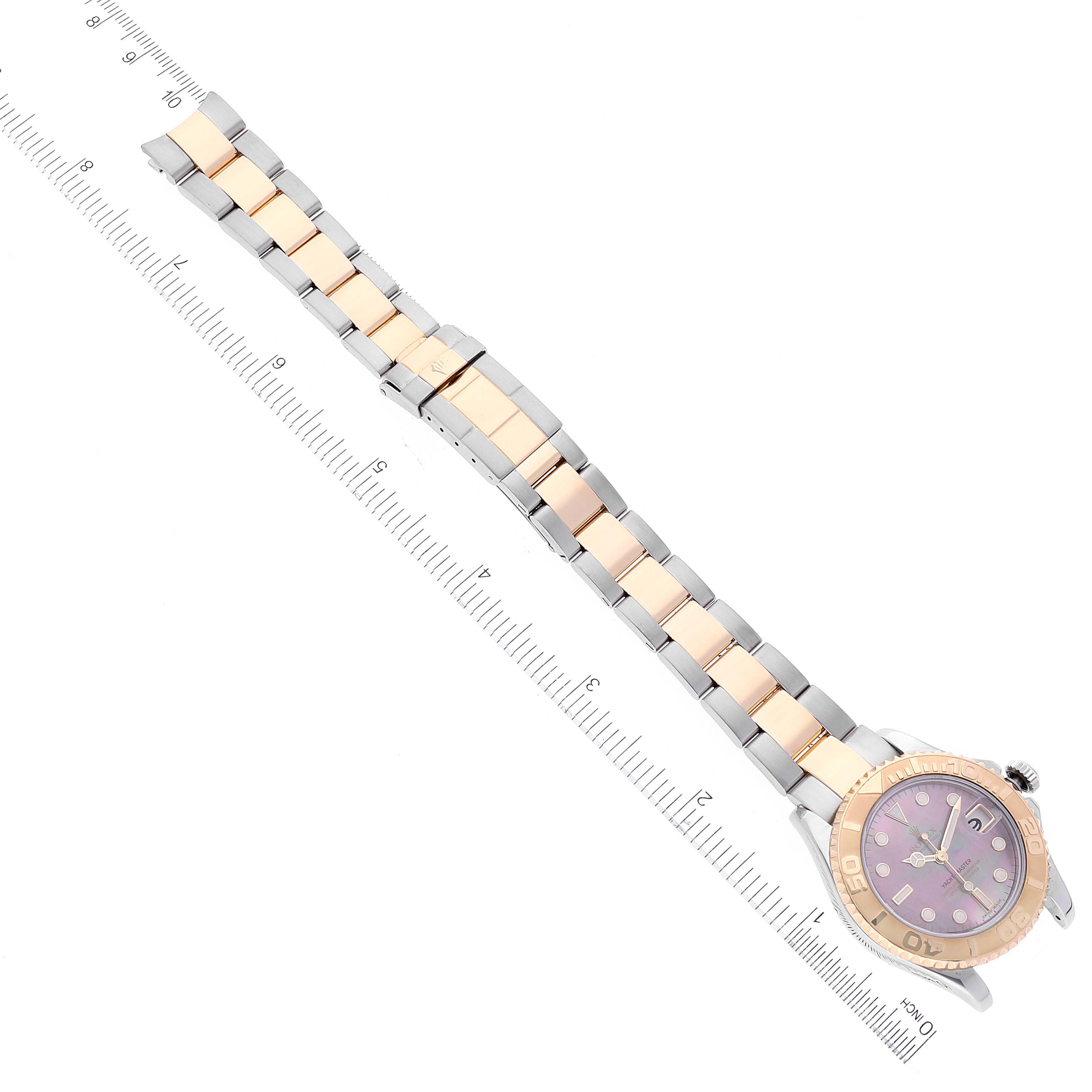 The image shows a full view of a Rolex Yacht-Master 168623 Men's Steel and Gold (two tone) Mother of Pearl Dial 168623 Men's Steel and Gold (two tone) Mother of Pearl Dial watch with its band and dial, positioned diagonally with a ruler for scale.