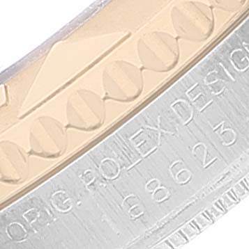 This image shows a close-up of the bezel and part of the case of a Rolex Yacht-Master 168623 Men's Steel and Gold (two tone) Mother of Pearl Dial 168623 Men's Steel and Gold (two tone) Mother of Pearl Dial watch.