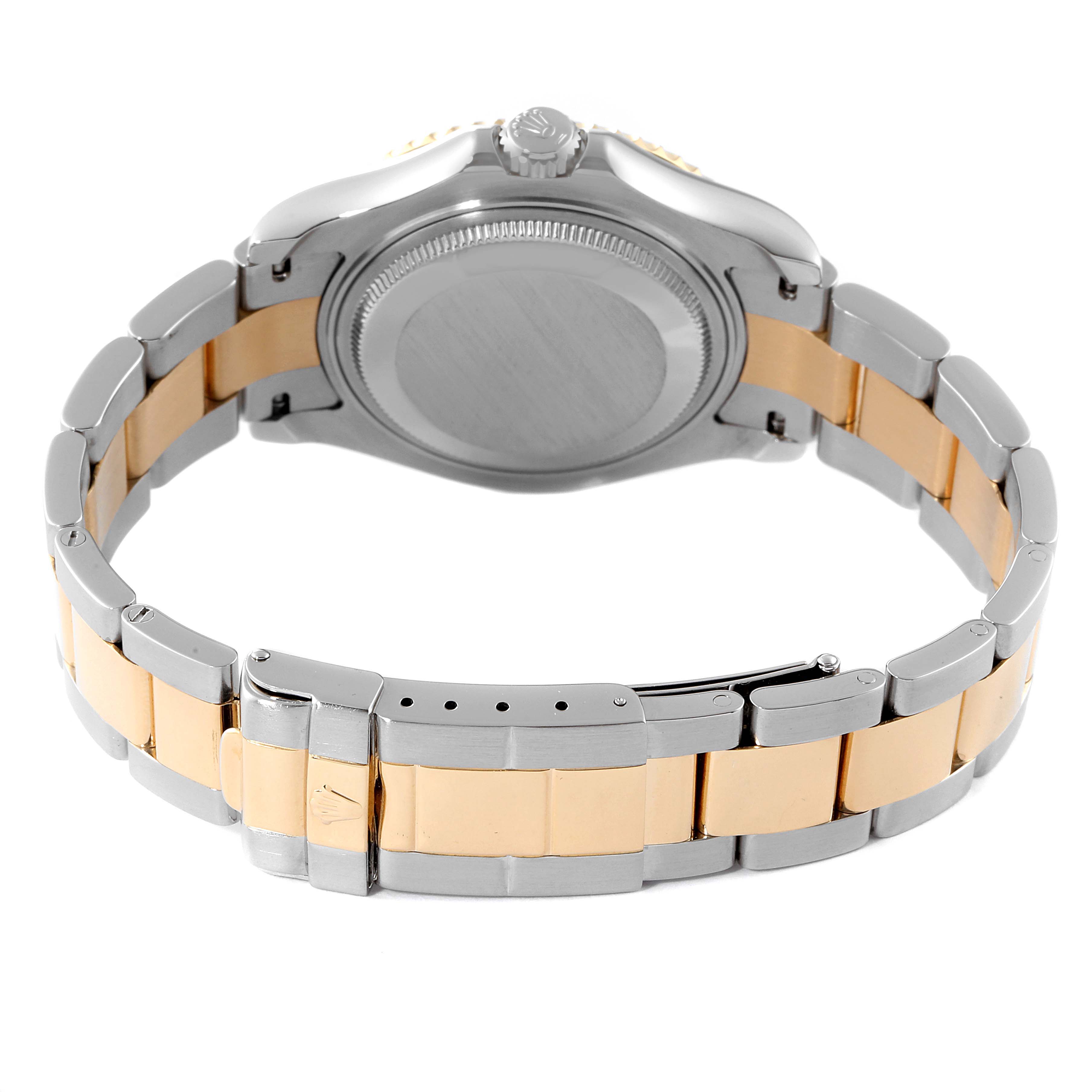 This image shows the back case and bracelet of a Rolex Yacht-Master 168623 Men's Steel and Gold (two tone) Mother of Pearl Dial 168623 Men's Steel and Gold (two tone) Mother of Pearl Dial watch, featuring a two-tone metal design.