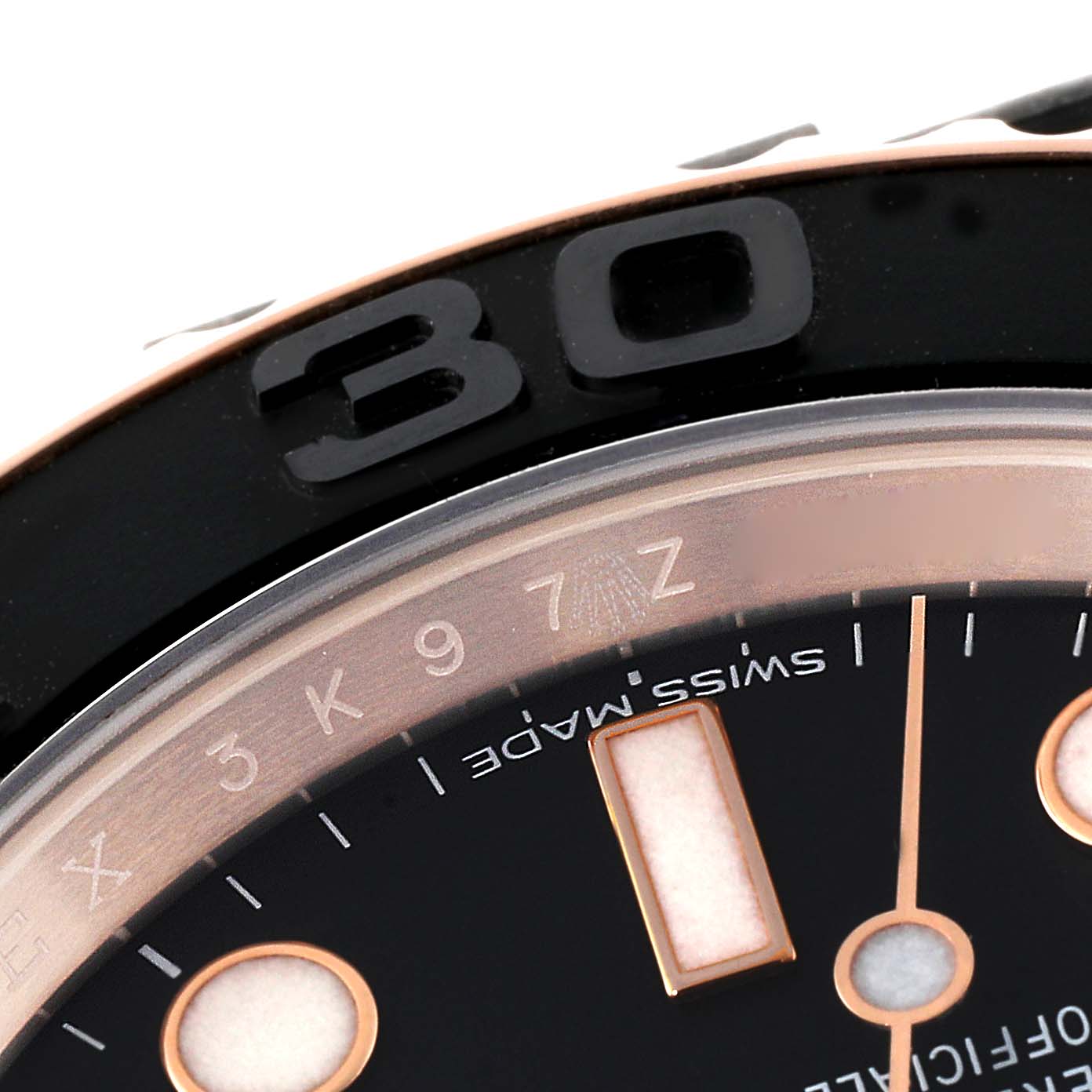 The image shows a close-up of the Yacht-Master model by Rolex, focusing on the bezel and partially the dial.