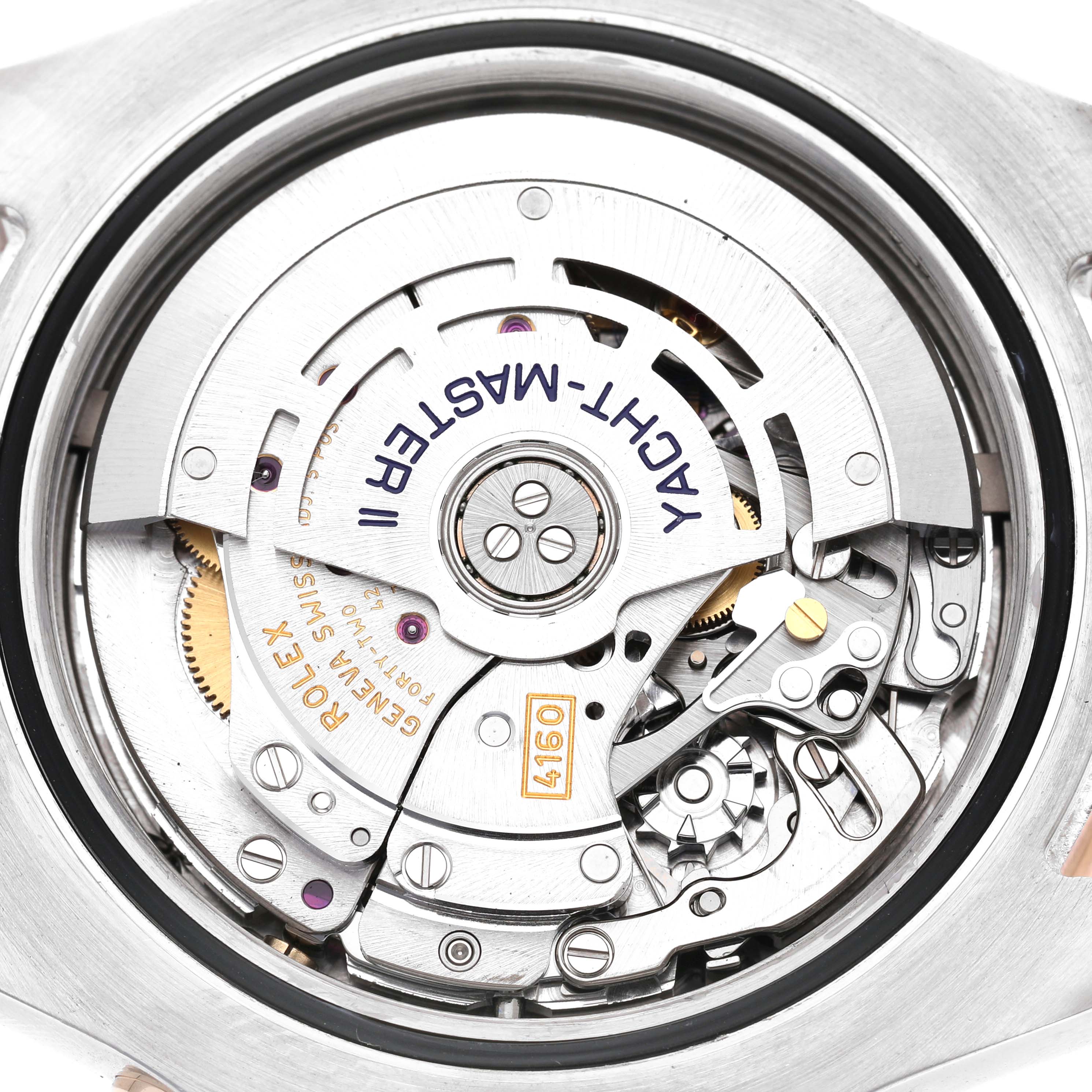 The image shows the movement of a Rolex Yacht-Master 116681 Men's Steel and Gold (two tone) White Dial II watch from a top-down angle, highlighting its intricate components.