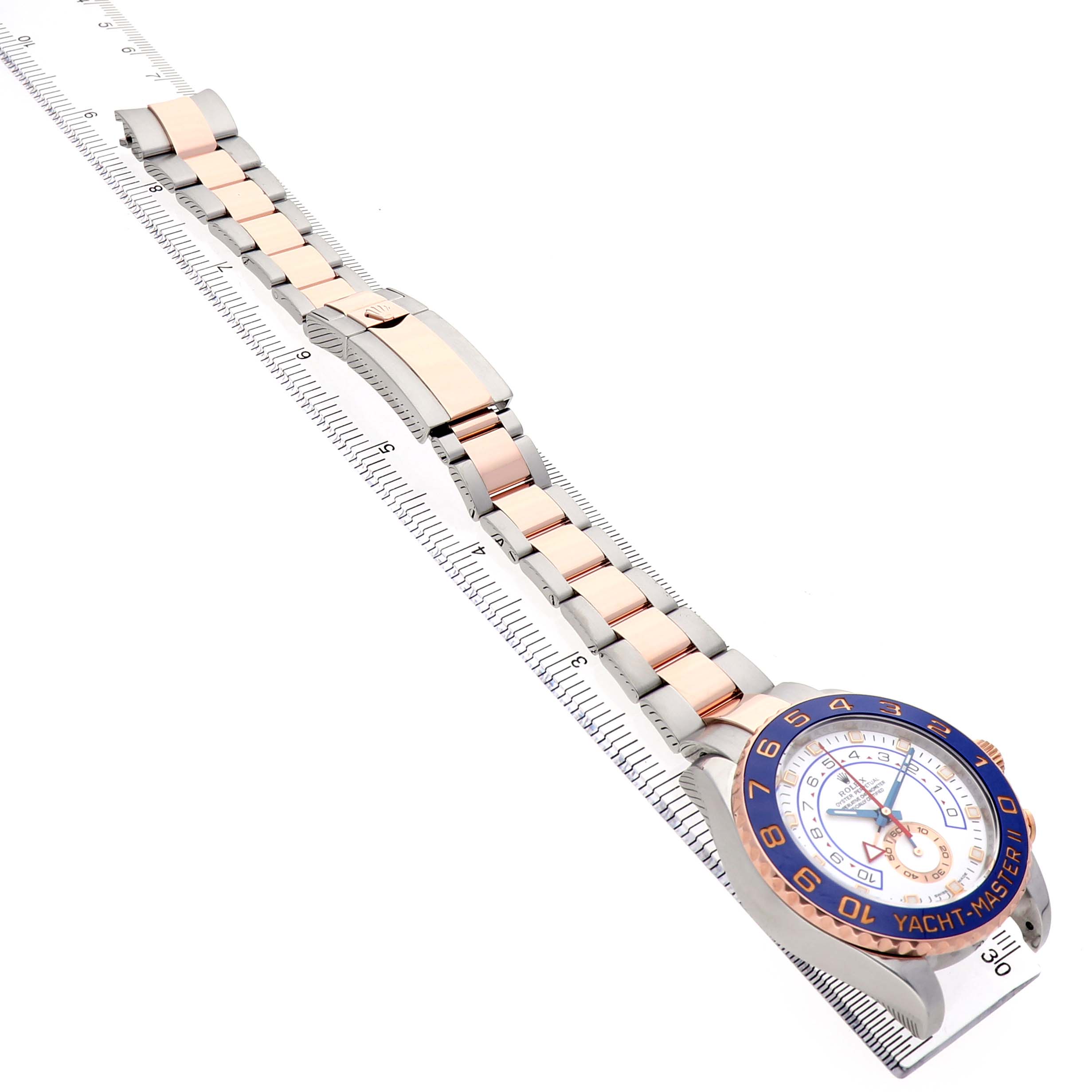The Rolex Yacht-Master 116681 Men's Steel and Gold (two tone) White Dial watch is shown diagonally, highlighting the bezel, dial, and two-tone bracelet.