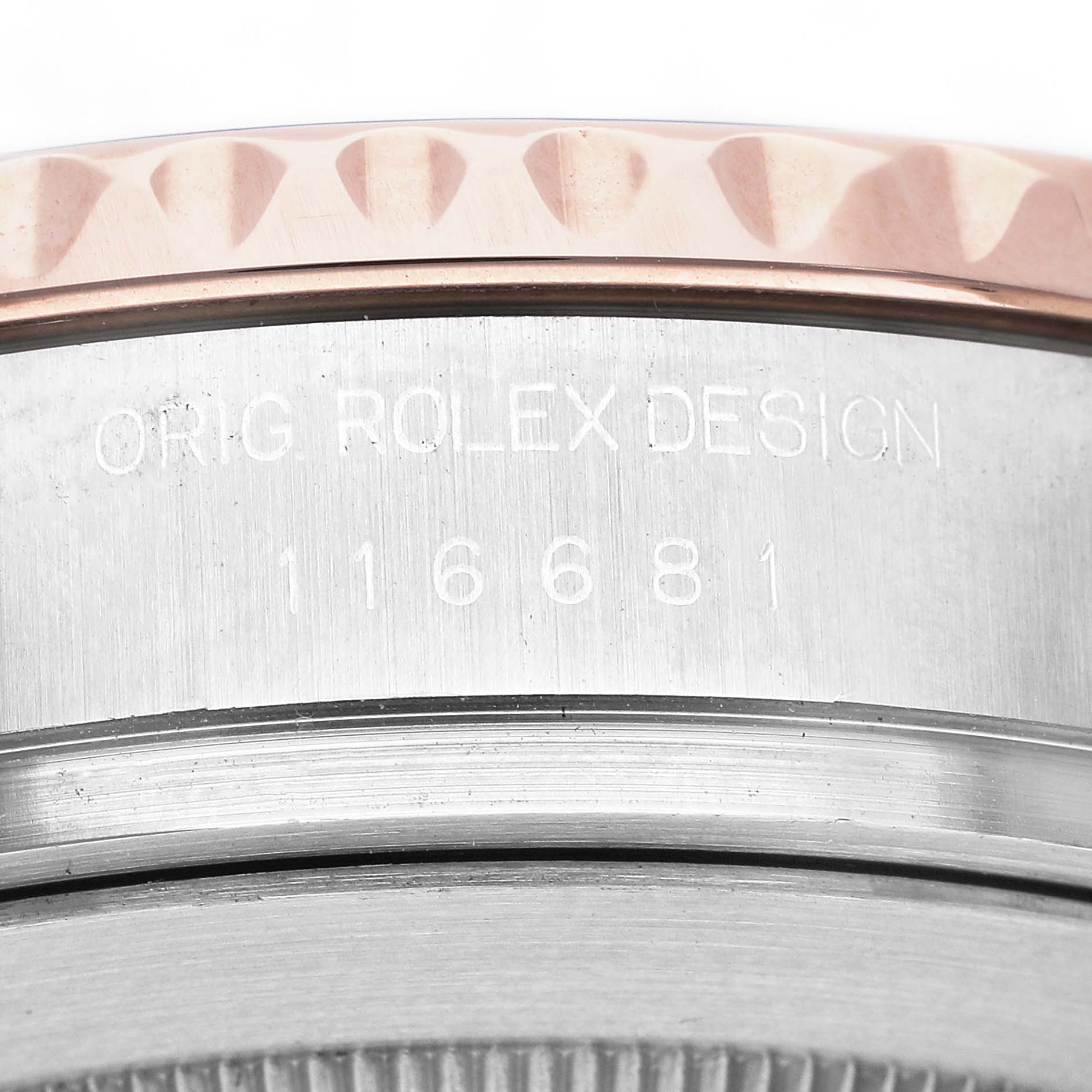 The image shows a close-up of the side of a Rolex Yacht-Master 116681 Men's Steel and Gold (two tone) White Dial watch, highlighting the bezel and engraved design number.