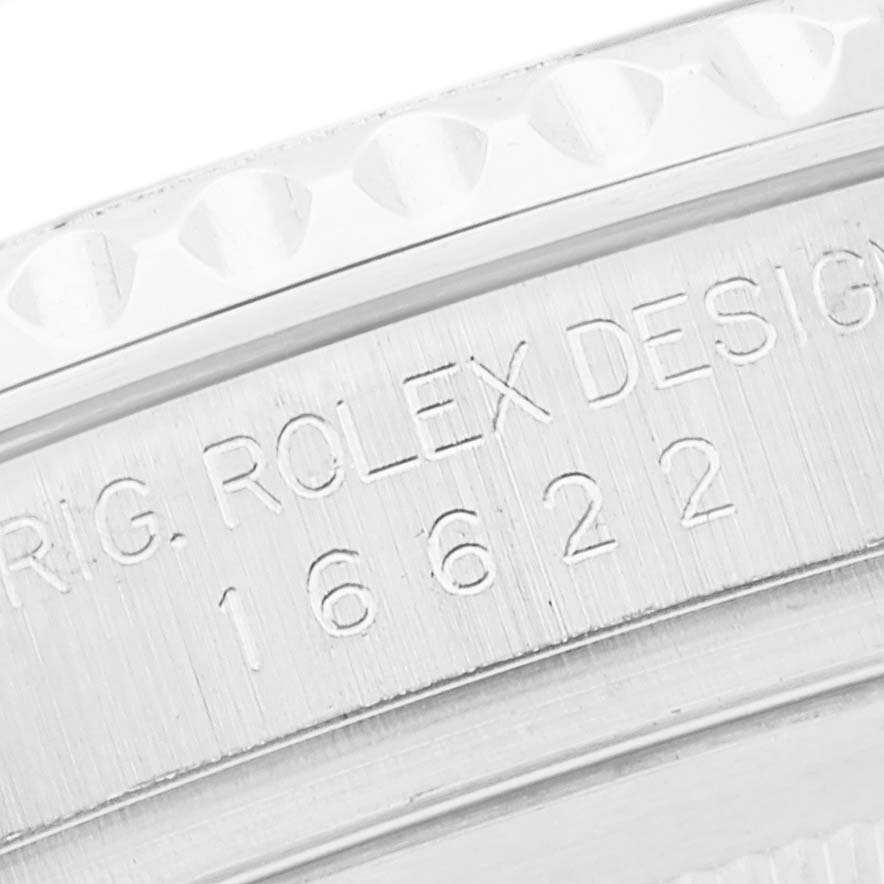 Close-up view of the Rolex Yacht-Master 16622 Men
s Stainless Steel Silver Dial 16622 Men
s Stainless Steel Silver Dial model
s case, showing its bezel and engraved serial number.