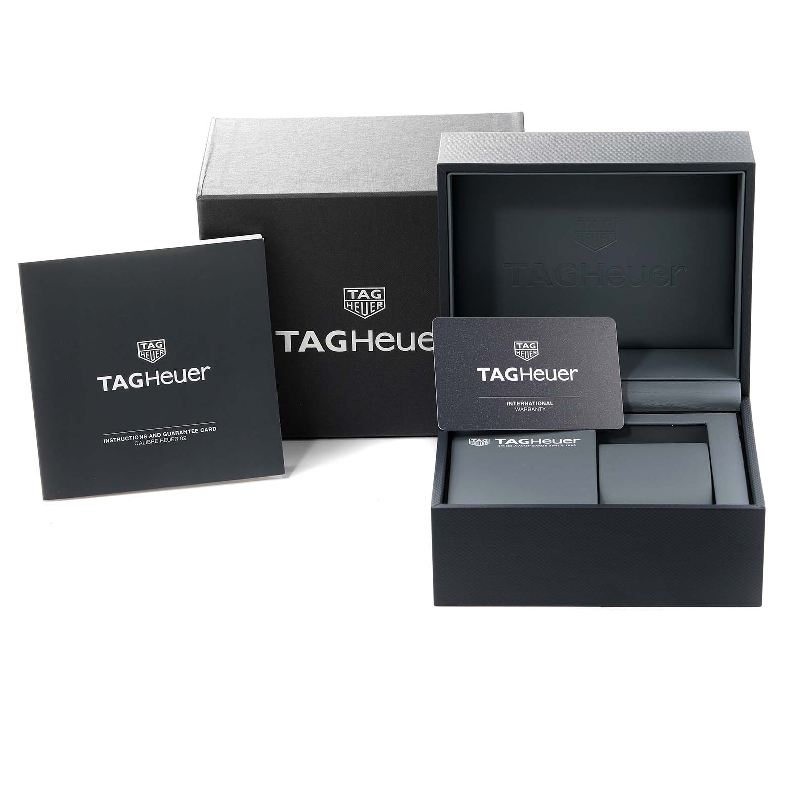 The image shows the Tag Heuer Carrera CBG2A10.BA0654 Men's Stainless Steel Black Dial CBG2A10.BA0654 Men's Stainless Steel Black Dial watch box, instruction manual, and guarantee card.