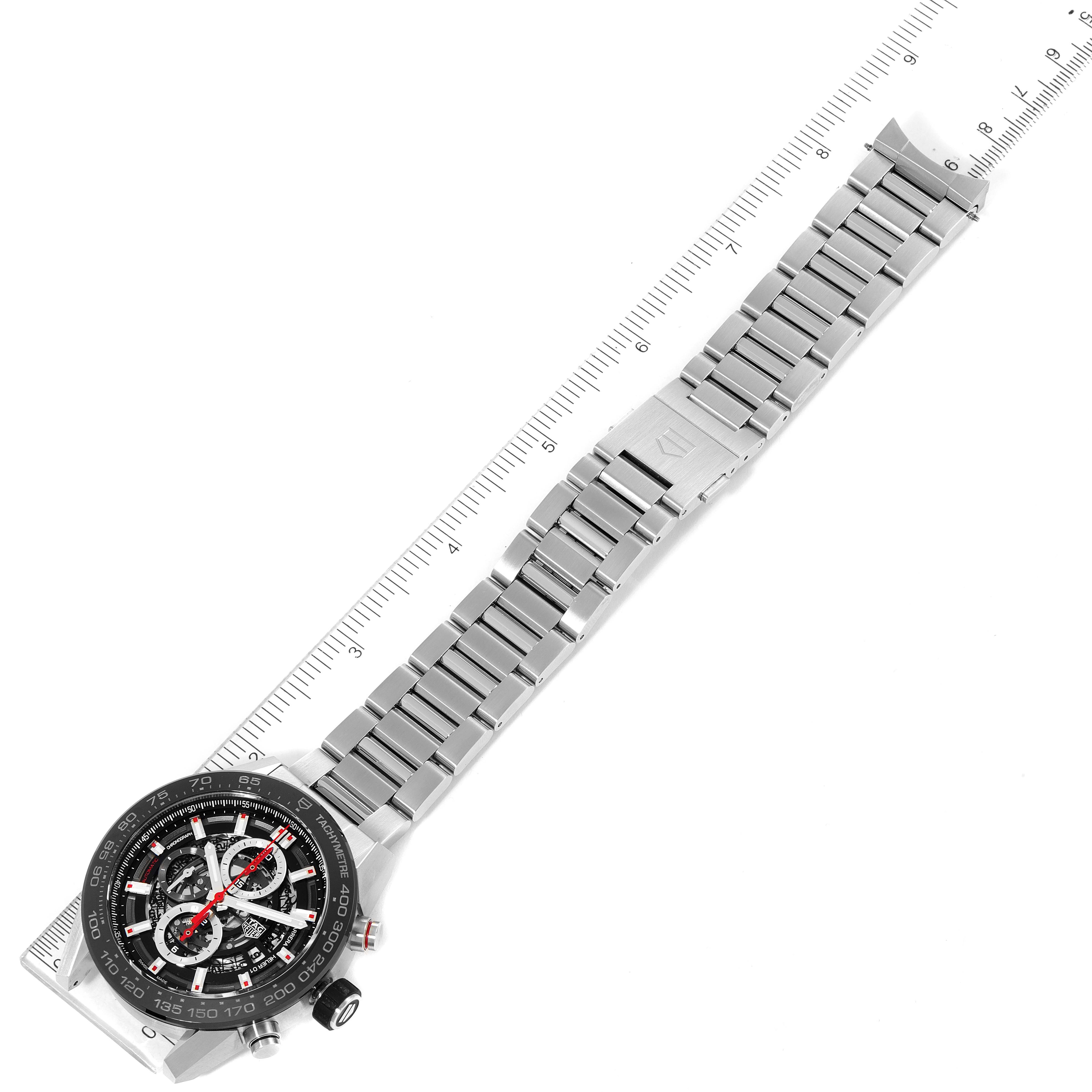 The image shows a Tag Heuer Carrera CAR2A1W.BA0703 Men's Stainless Steel Transparent Dial CAR2A1W.BA0703 Men's Stainless Steel Transparent Dial watch laid flat with a metal bracelet and ruler for size reference, photographed from above.