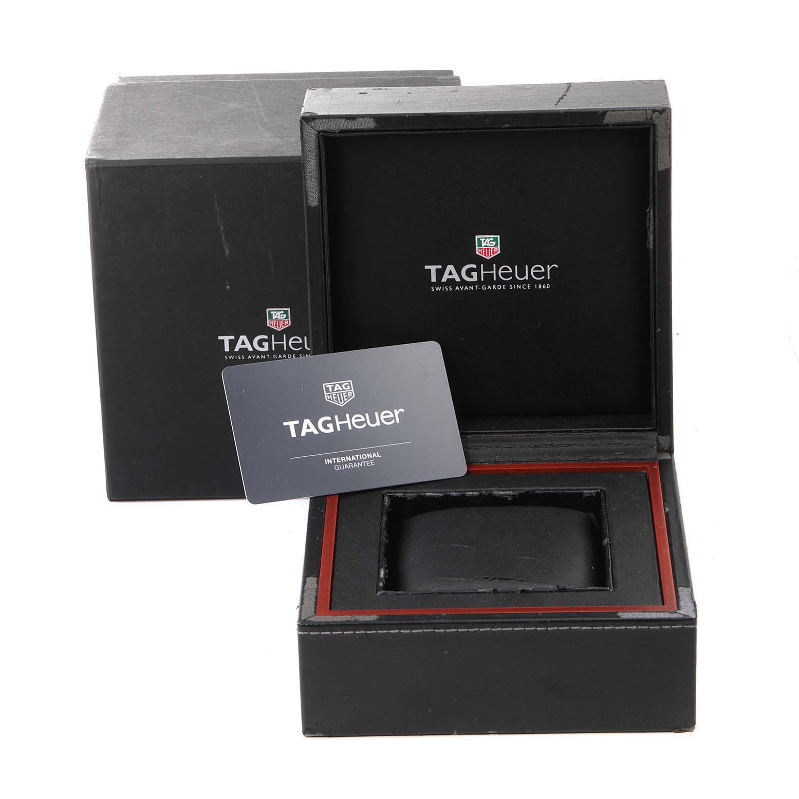 The image shows the empty case and warranty card for a Tag Heuer Carrera CAR2A1W.BA0703 Men's Stainless Steel Transparent Dial CAR2A1W.BA0703 Men's Stainless Steel Transparent Dial watch.