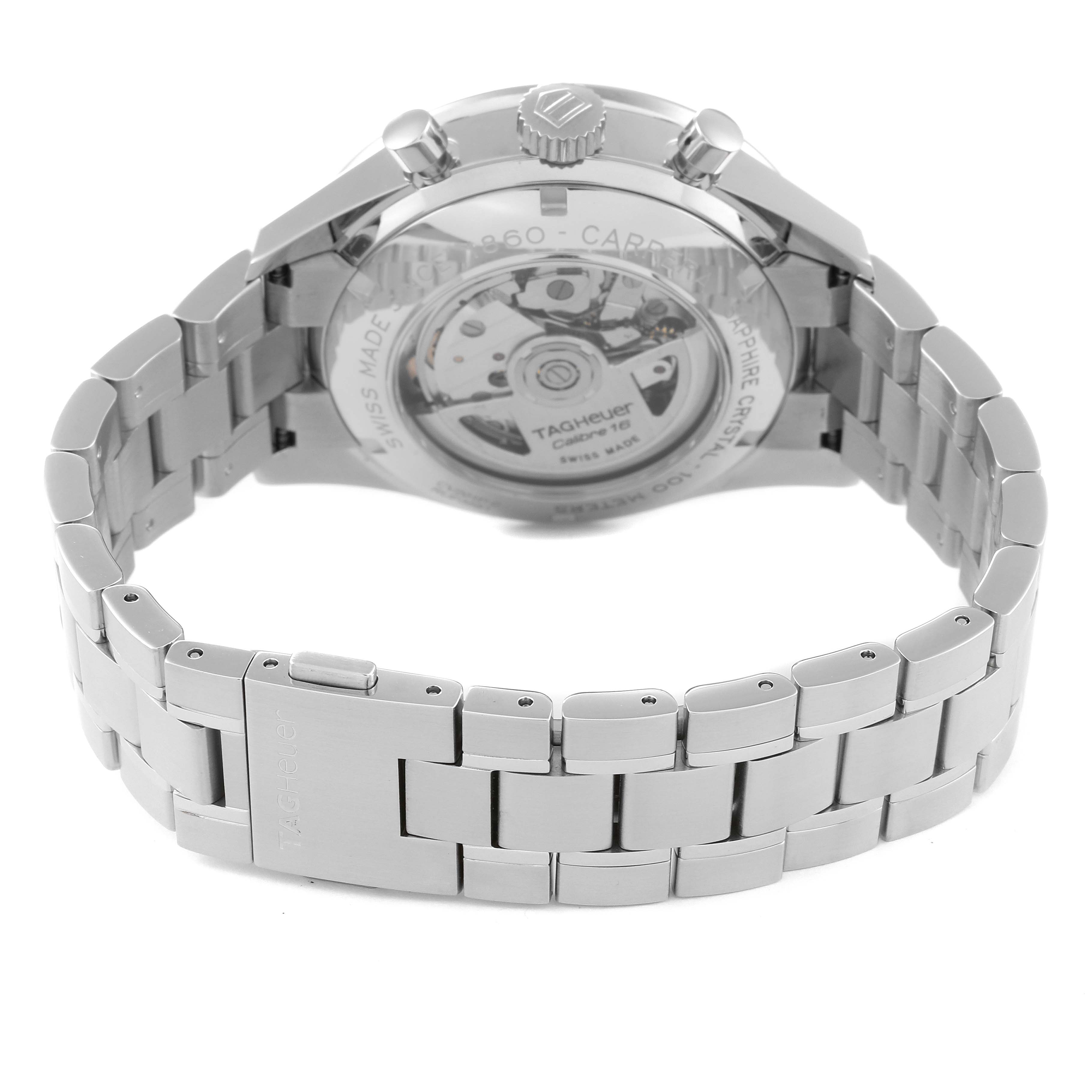 The image shows the back view of a Carrera model watch by Tag Heuer, highlighting the transparent case back and metal bracelet.