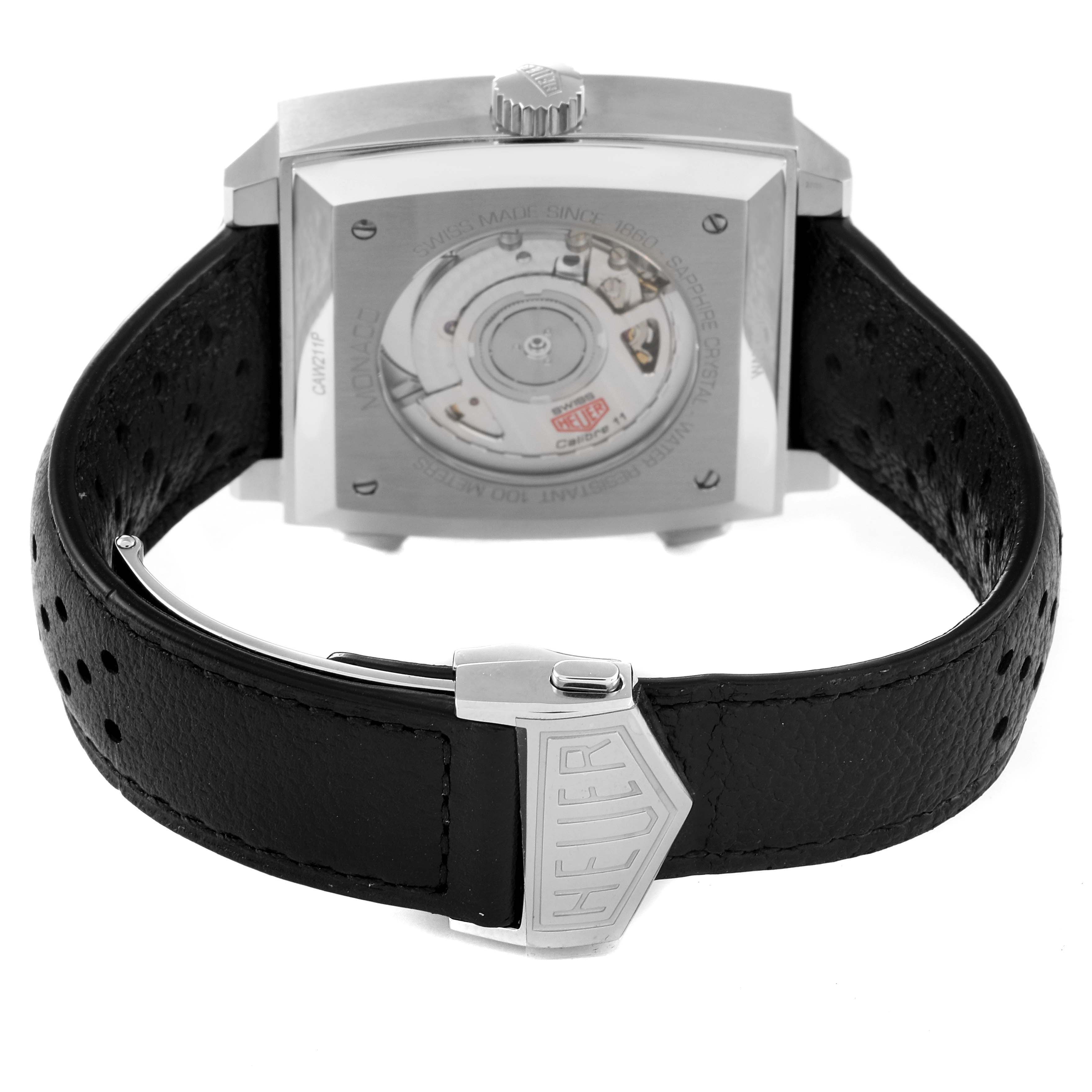 The image shows the back view of a Tag Heuer Monaco CAW211P Men's Stainless Steel Blue Dial CAW211P Men's Stainless Steel Blue Dial watch, highlighting the movement and clasp on the leather strap.