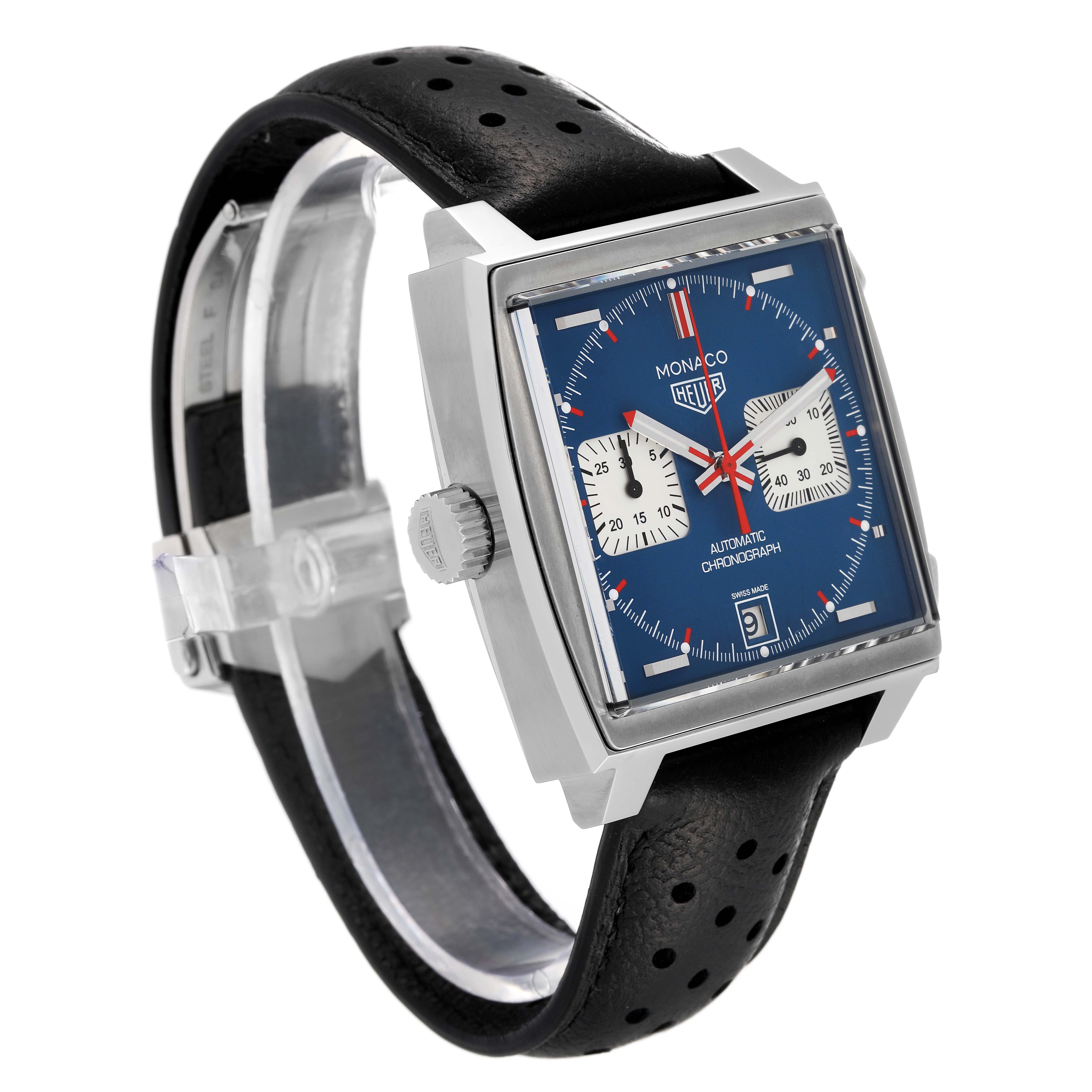 The image shows a side-front view of the Tag Heuer Monaco CAW211P Men's Stainless Steel Blue Dial CAW211P Men's Stainless Steel Blue Dial watch, highlighting its square blue dial, chronograph subdials, and black leather strap.