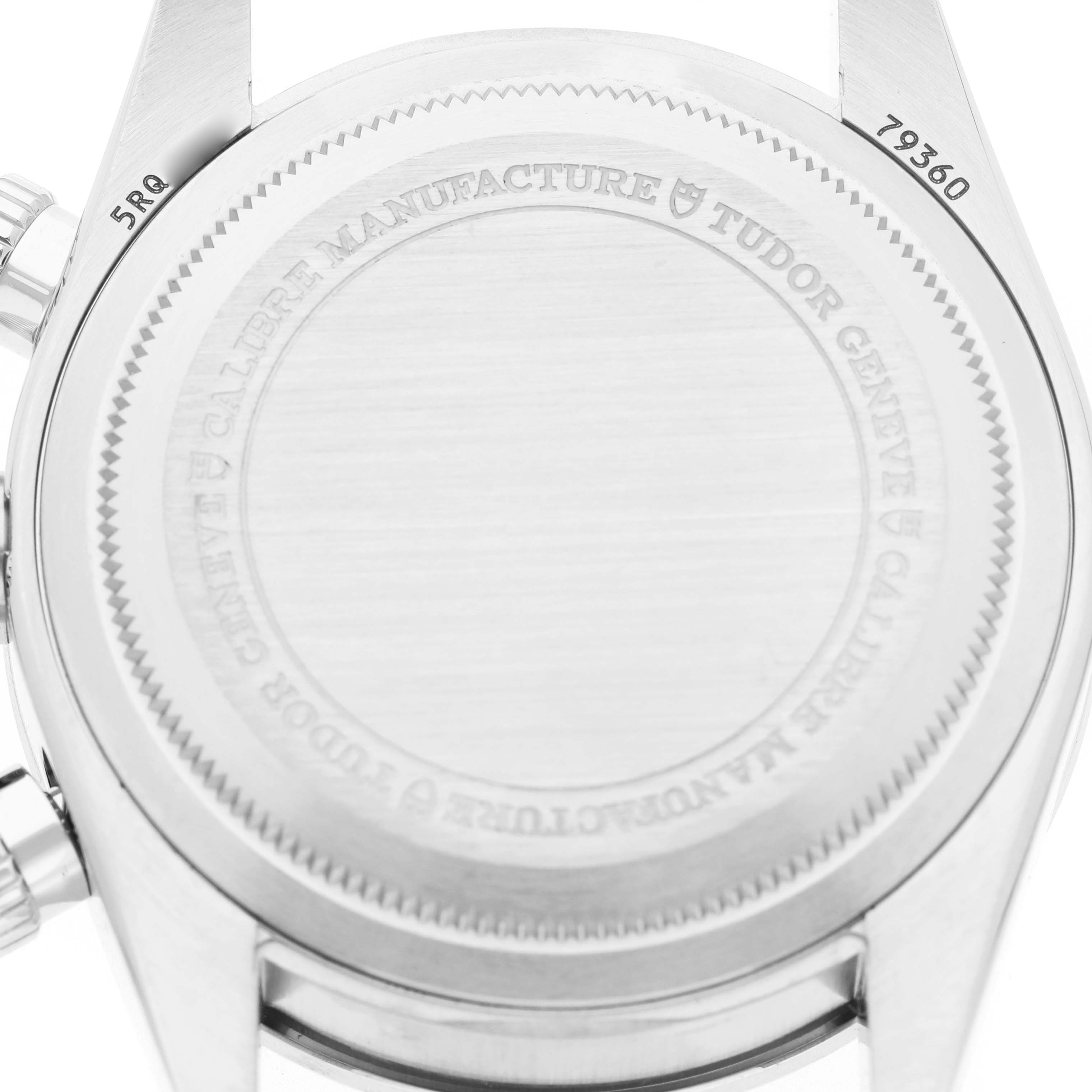The image shows the case back of the Tudor Heritage Black Bay M79360N-0019 Men's Stainless Steel Pink Dial watch, featuring engraved details and reference numbers.