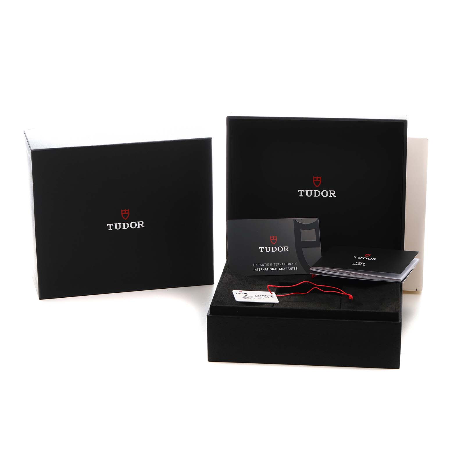 The image shows a Tudor Heritage Black Bay M79360N-0019 Men's Stainless Steel Pink Dial watch packaging, guarantee card, booklet, and tag.
