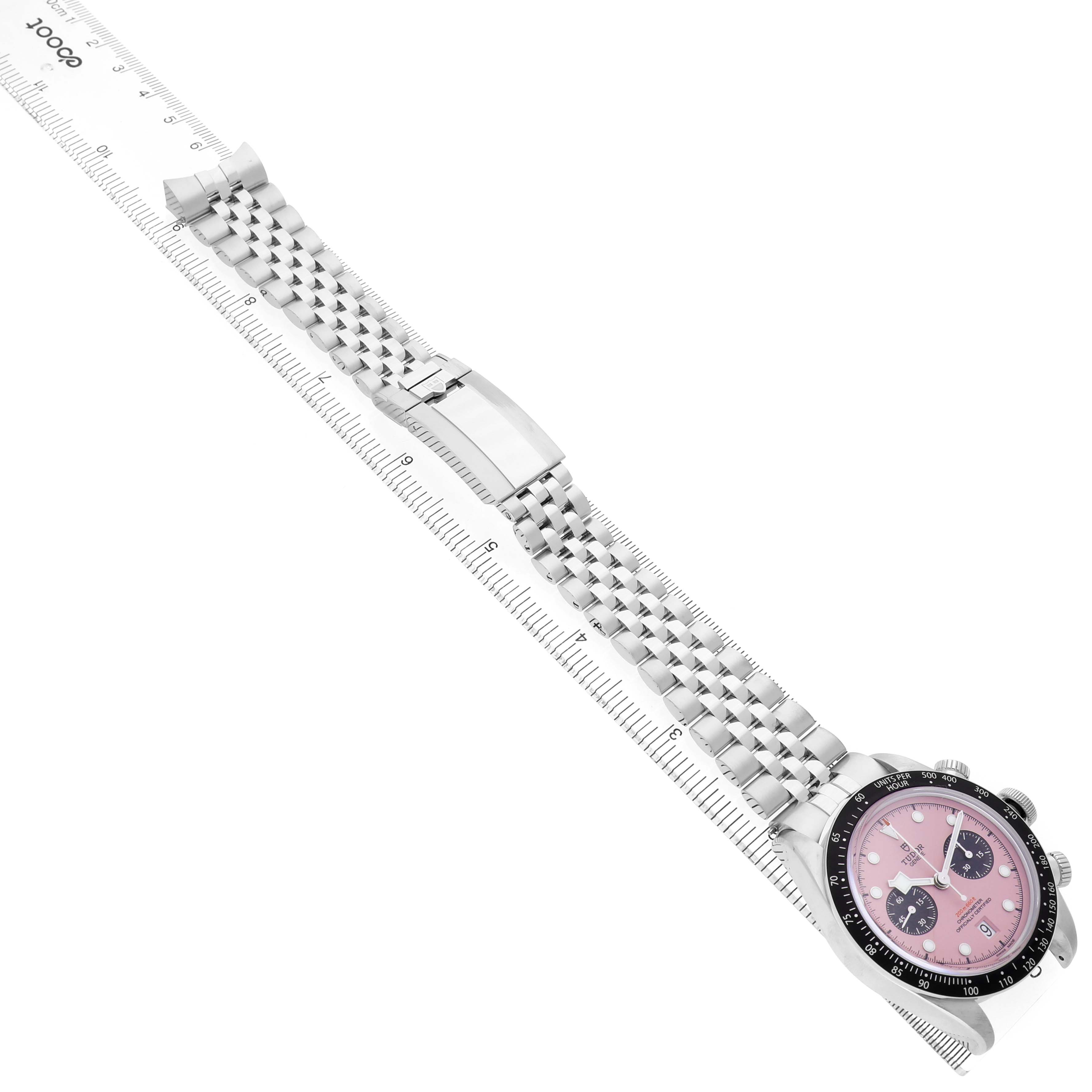 The image shows a Tudor Heritage Black Bay M79360N-0019 Men's Stainless Steel Pink Dial watch and bracelet extended flat with a focus on the pink dial and clasp.
