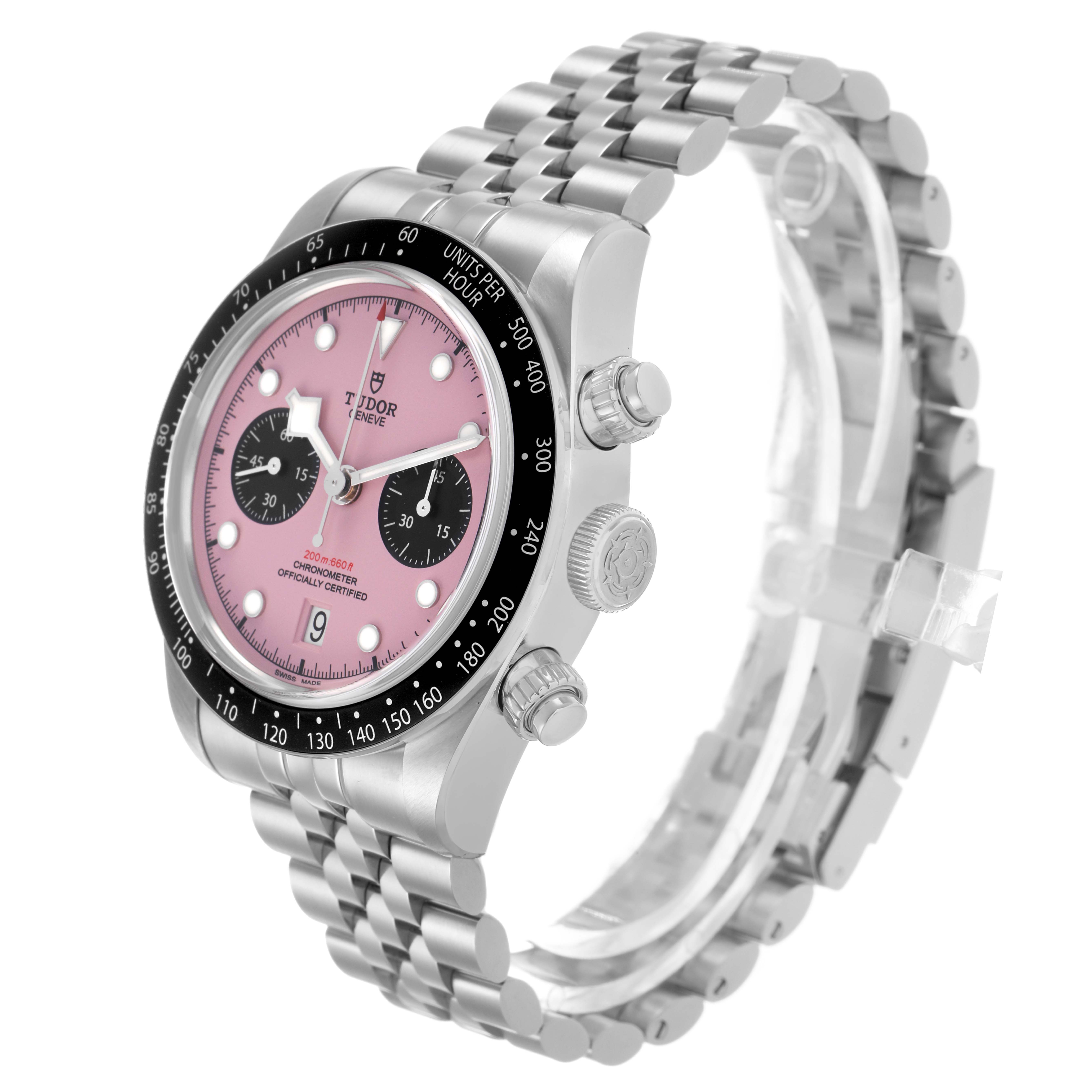 The Tudor Heritage Black Bay M79360N-0019 Men's Stainless Steel Pink Dial watch is shown at a three-quarter angle, displaying the face, bezel, crown, and bracelet.