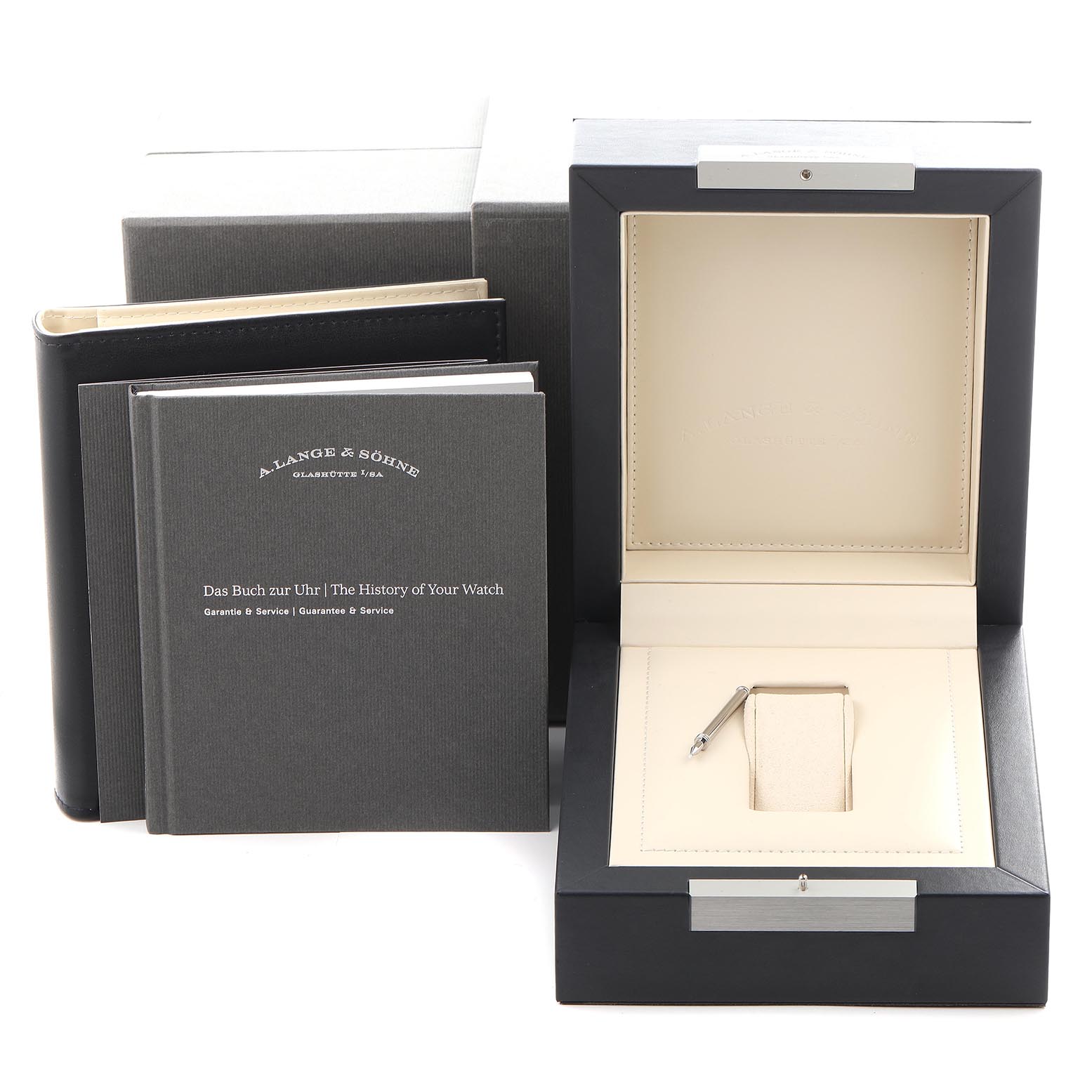 The image shows a closed A. Lange 
Sohne Lange 1 182.086/LSLS823AX Men
s White Gold Blue Dial watch box and accompanying booklets from a front angle.
