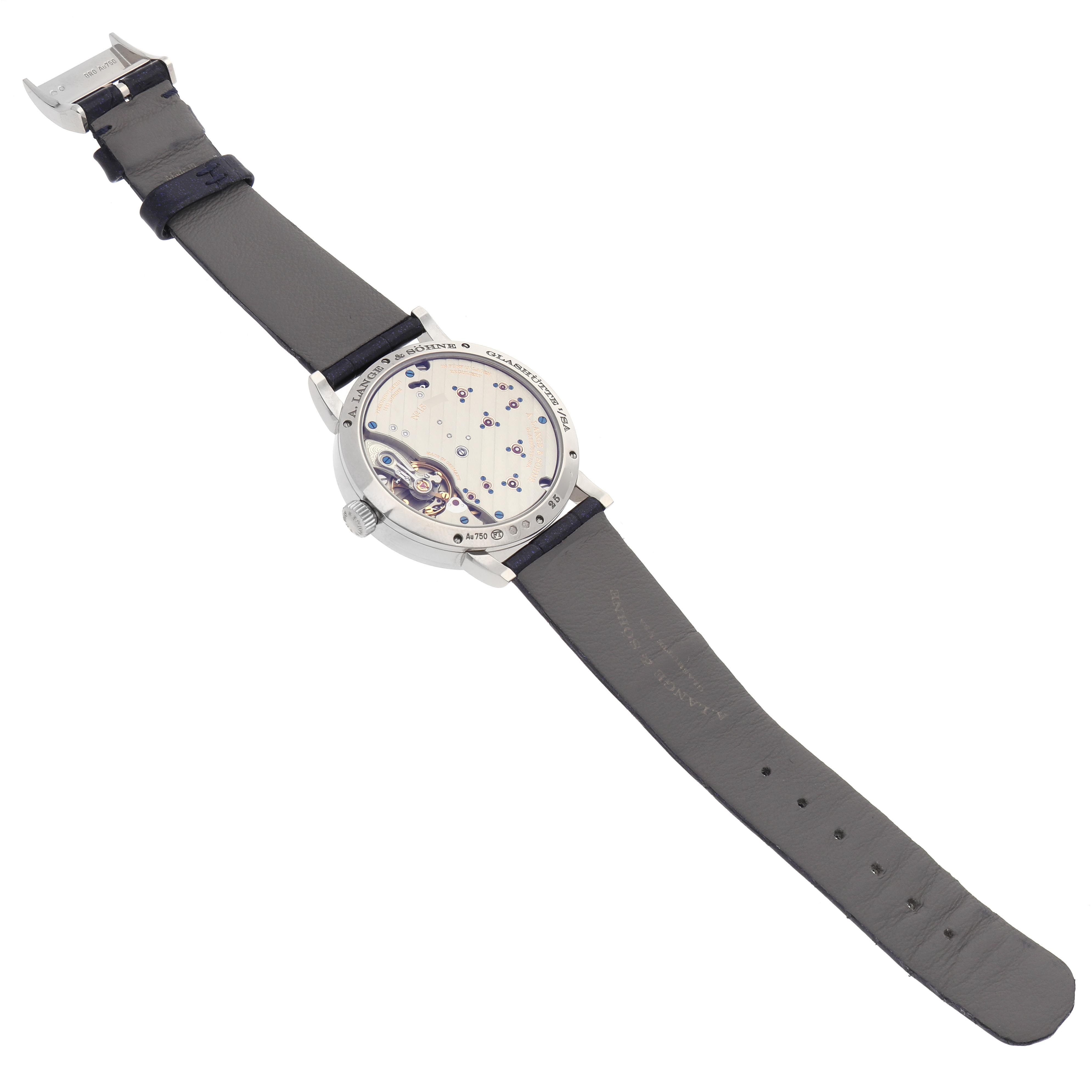 The image shows the back view of an A. Lange 
Sohne Lange 1 182.086/LSLS823AX Men
s White Gold Blue Dial watch, highlighting the movement and strap.