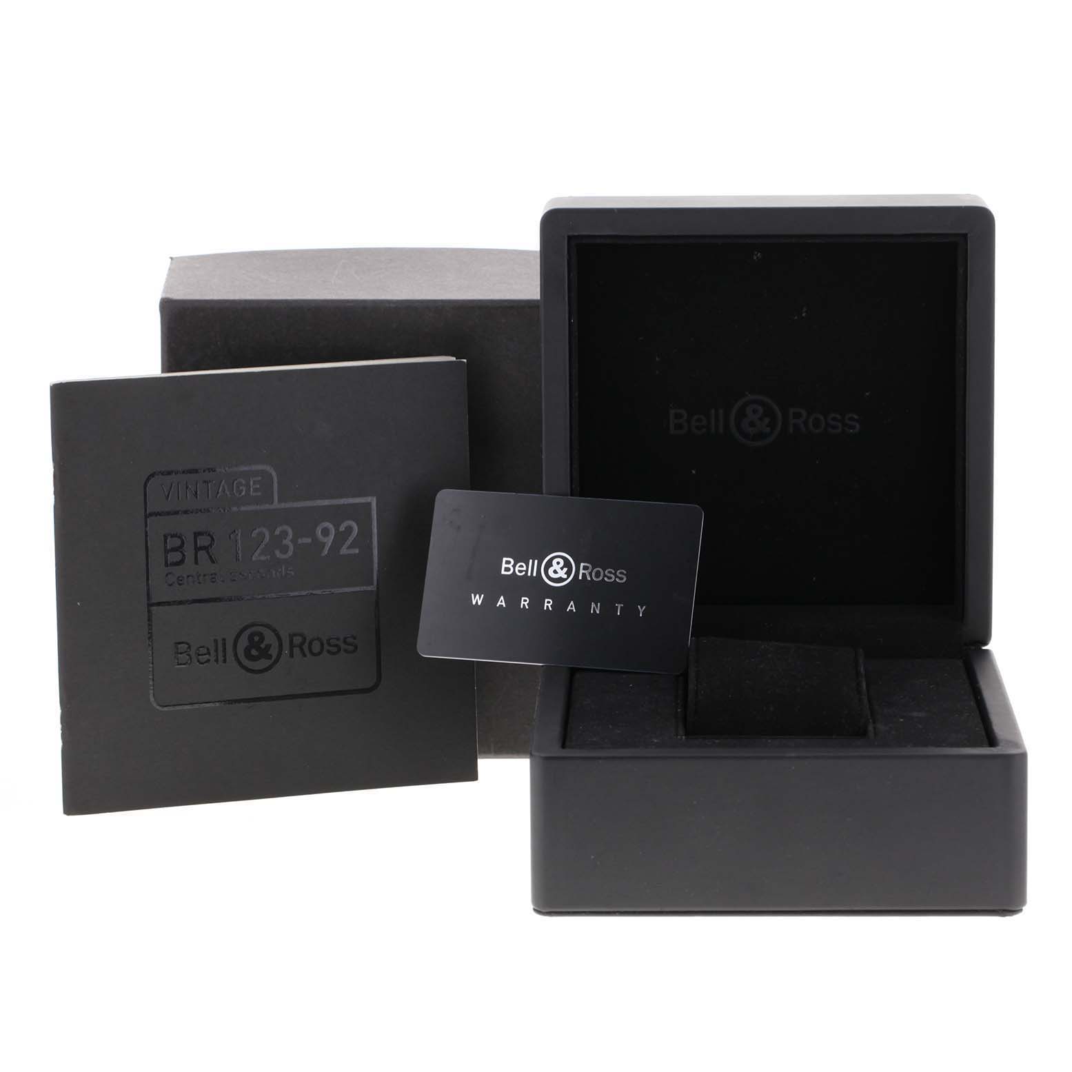 This image shows the packaging, warranty card, and box for the Bell & Ross Heritage BRV123-ST-HER/SST Men's Stainless Steel Black Dial BRV123-ST-HER/SST Men's Stainless Steel Black Dial BR 123-92 watch.