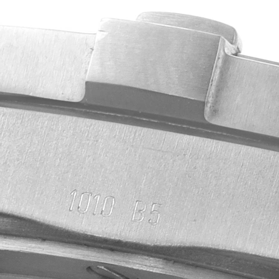The image shows a close-up of the side of a Breitling Professional Series E79362 Men's Titanium Grey Dial E79362 Men's Titanium Grey Dial watch, highlighting the bezel and engraving "1010 B5".