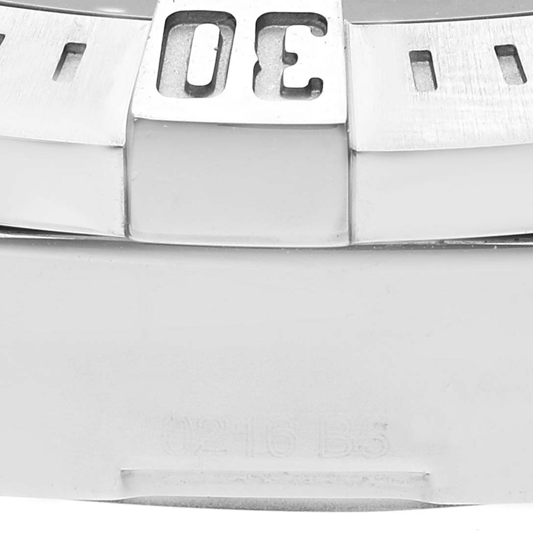 The image shows a close-up of the bezel and part of the case back of the Breitling Colt A17388 Men's Stainless Steel Black Dial A17388 Men's Stainless Steel Black Dial watch, focusing on the 30-minute mark.