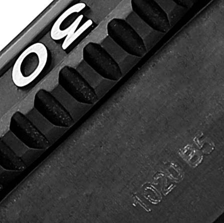 The image shows a close-up of the bezel and part of the case of a Breitling Superocean M17368 Men's Stainless Steel Black Dial M17368 Men's Stainless Steel Black Dial watch.