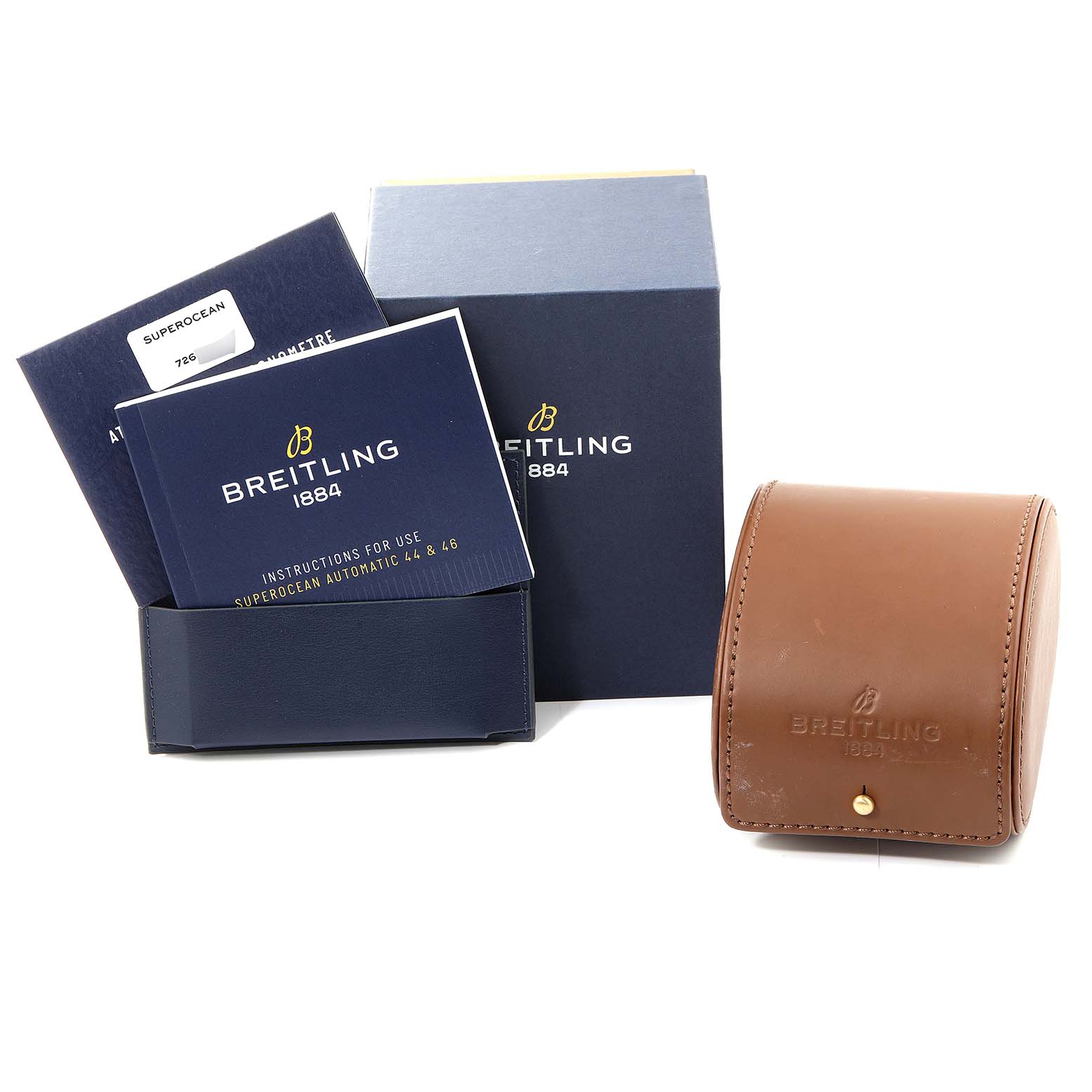 The image shows a Breitling Superocean M17368 Men's Stainless Steel Black Dial M17368 Men's Stainless Steel Black Dial watch box, manuals, and a leather watch case from a front angle.