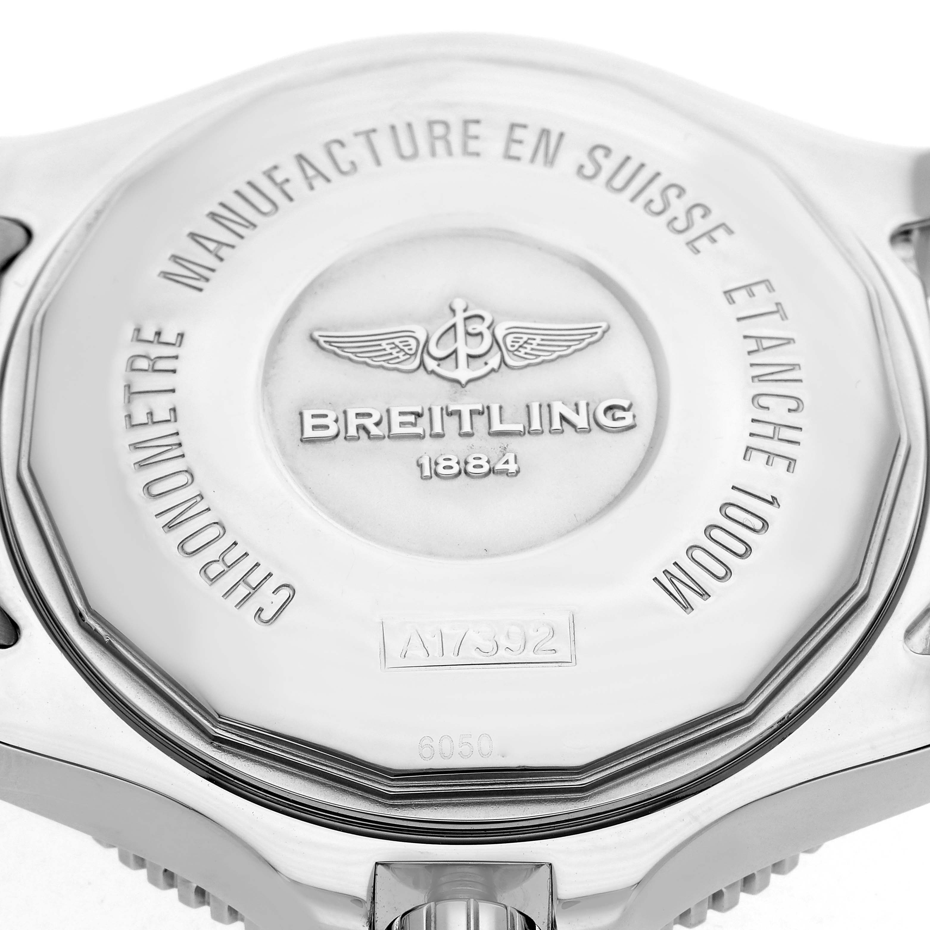 The image shows the back of the Breitling Superocean A17392 Men
s Stainless Steel Black Dial A17392 Men
s Stainless Steel Black Dial watch, highlighting its engraved details and logo.