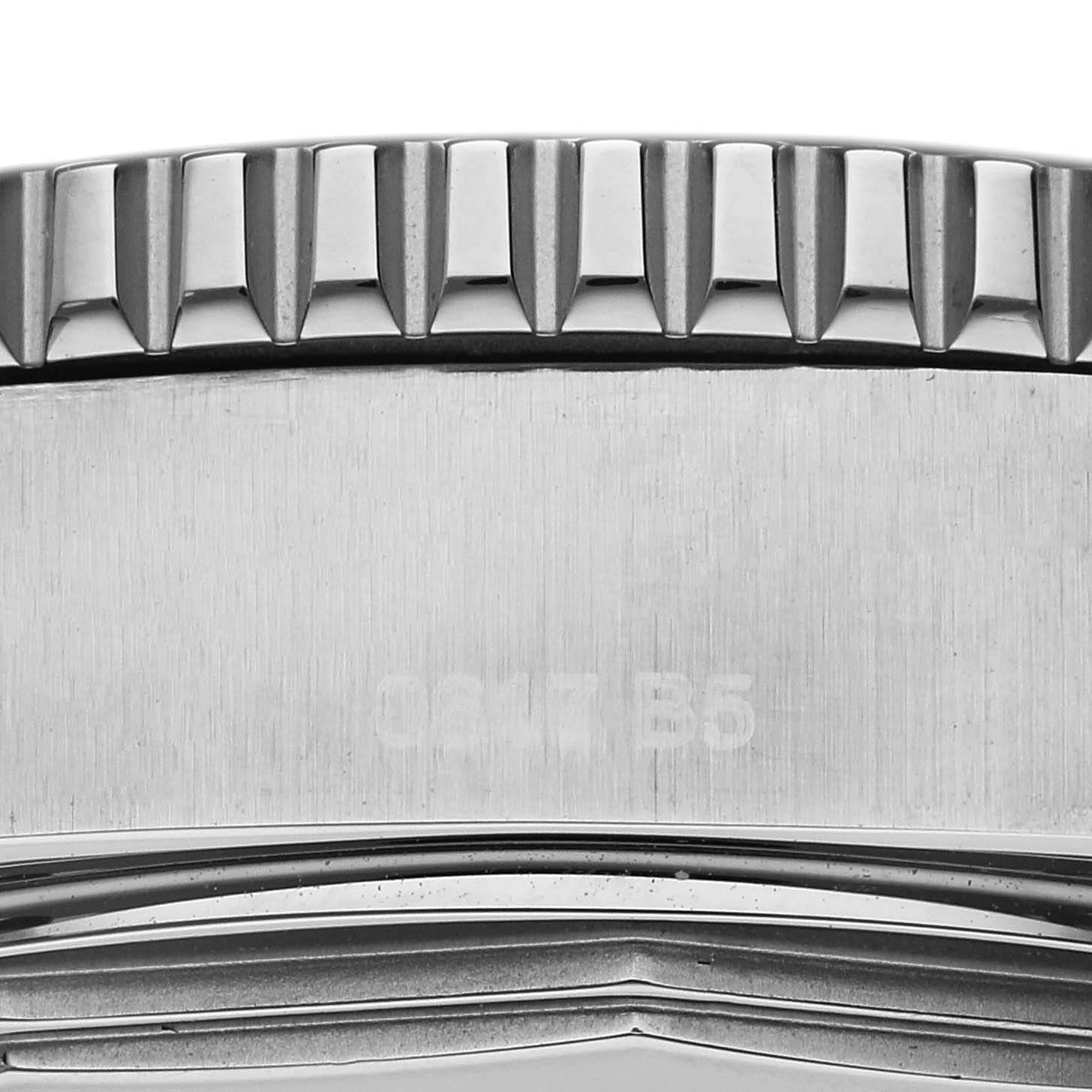 The close-up image shows the side of the bezel and case back of a Breitling Superocean A17392 Men
s Stainless Steel Black Dial A17392 Men
s Stainless Steel Black Dial watch, highlighting its brushed and ridged textures.