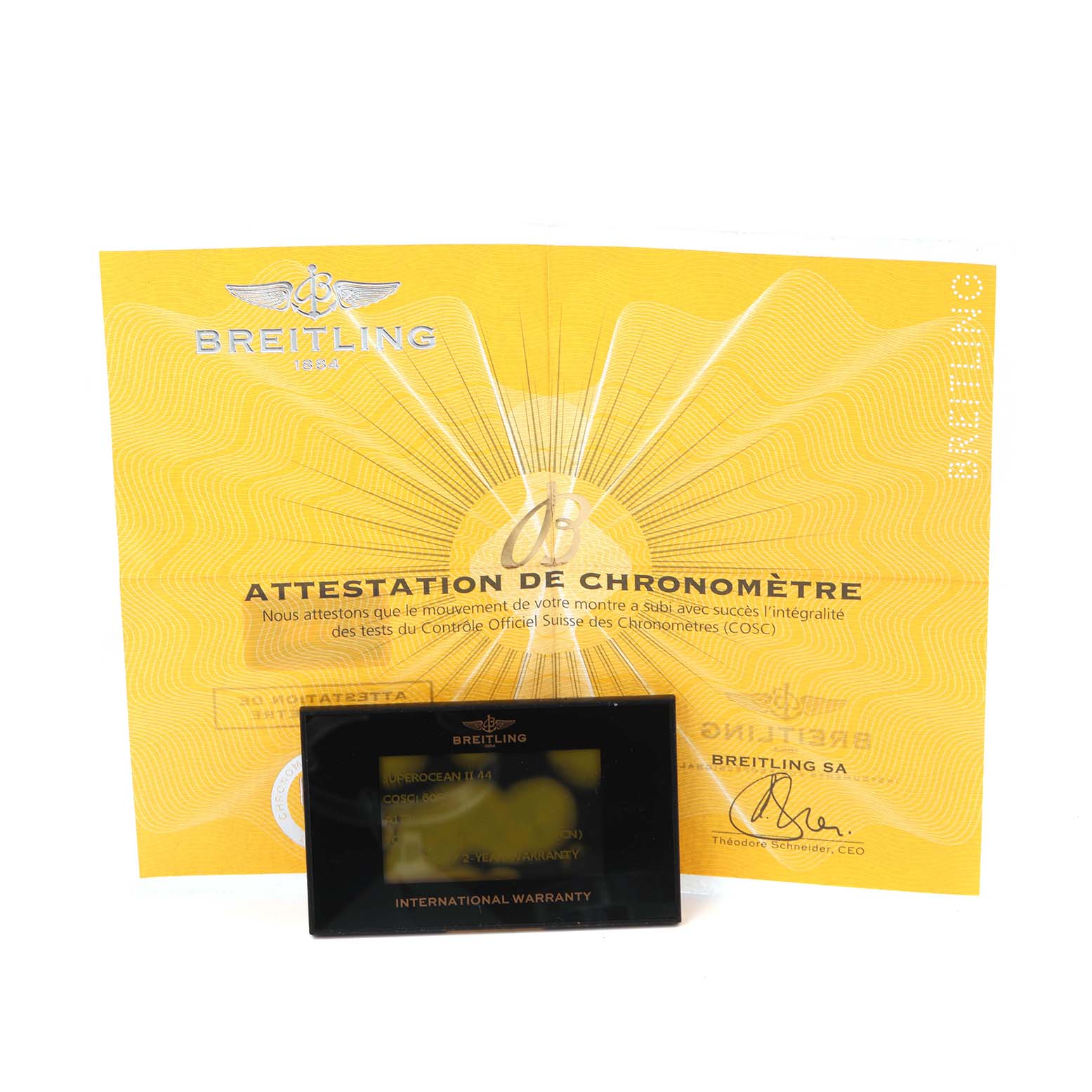 The image shows a Breitling Superocean A17392 Men
s Stainless Steel Black Dial A17392 Men
s Stainless Steel Black Dial warranty card and a chronometer certificate.