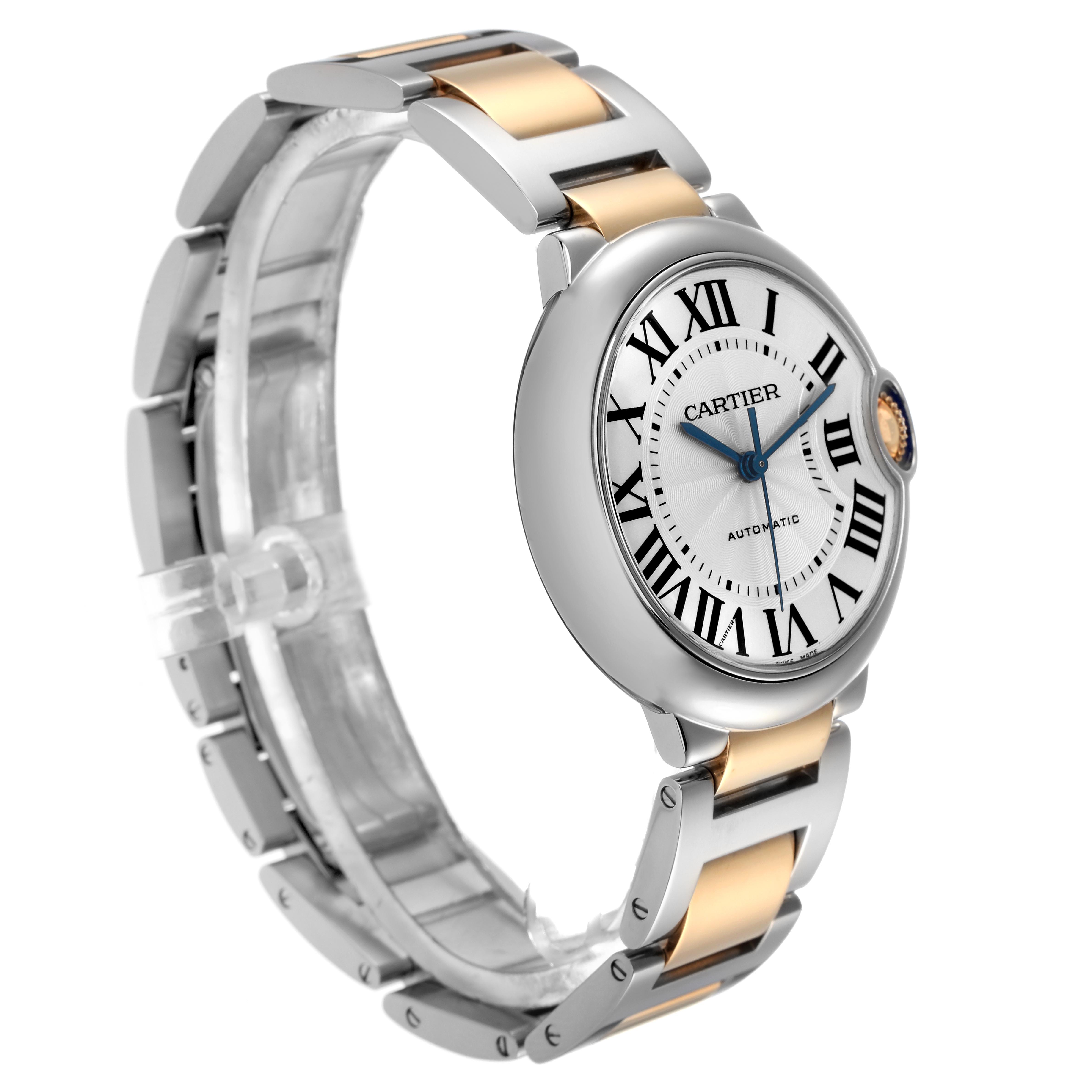 The Cartier Ballon Bleu W2BB0012 Women
s Steel and Gold (two tone) Silver Dial W2BB0012 Women
s Steel and Gold (two tone) Silver Dial watch is shown at a slight side angle, highlighting its face, Roman numerals, and two-tone bracelet.
