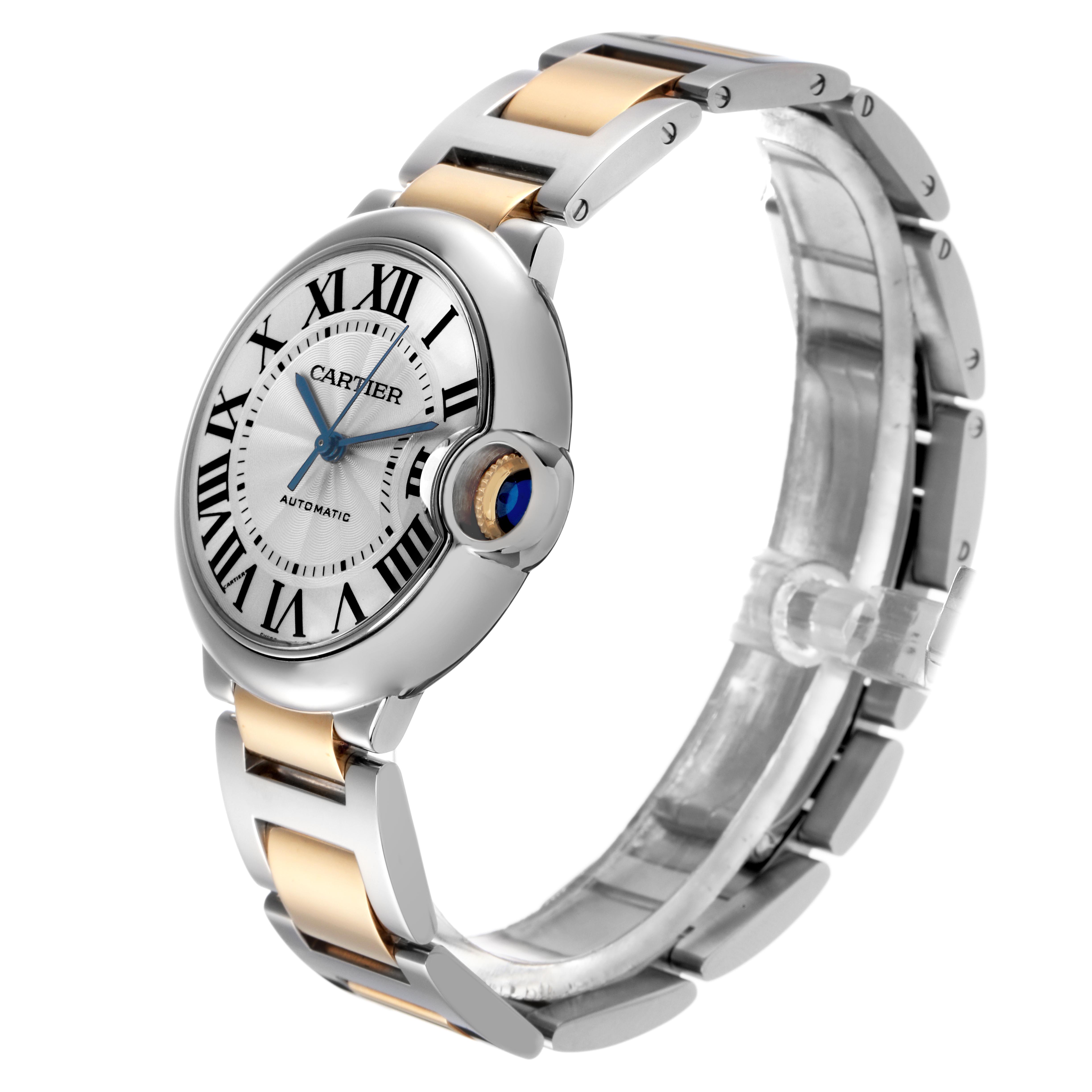 The Cartier Ballon Bleu W2BB0012 Women
s Steel and Gold (two tone) Silver Dial W2BB0012 Women
s Steel and Gold (two tone) Silver Dial watch is shown at an angled side view, highlighting the face, bezel, crown, and two-tone bracelet.