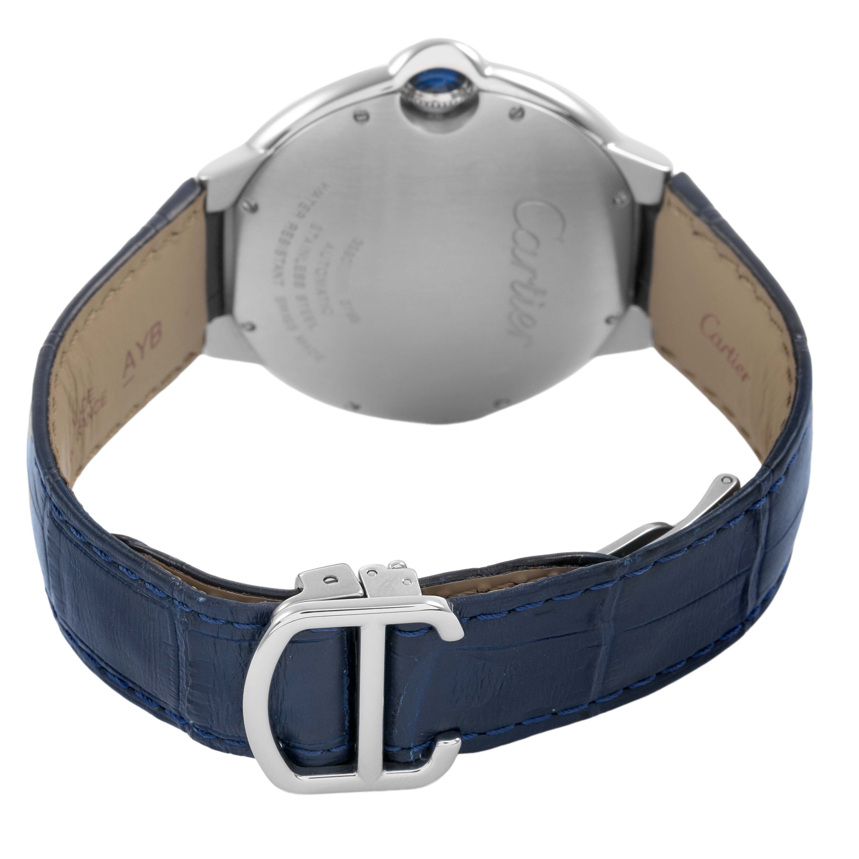 The Cartier Ballon Bleu WSBB0025 Men's Stainless Steel Blue Dial watch is shown from the back, highlighting the case, clasp, and blue leather strap.