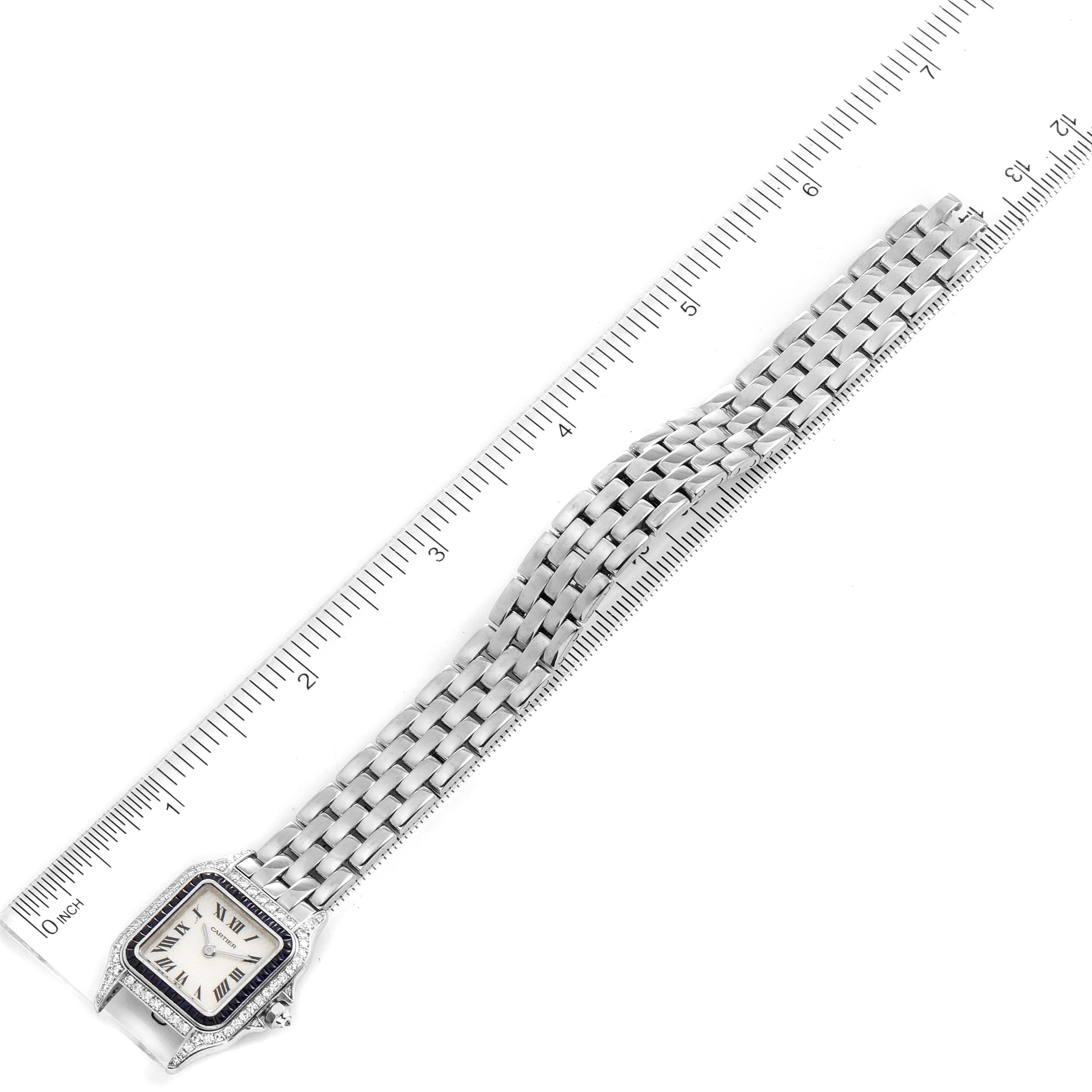 This image shows a Cartier Panthere 2362 Women's White Gold Mother of Pearl Dial 2362 Women's White Gold Mother of Pearl Dial watch laid flat next to a ruler to display its length.