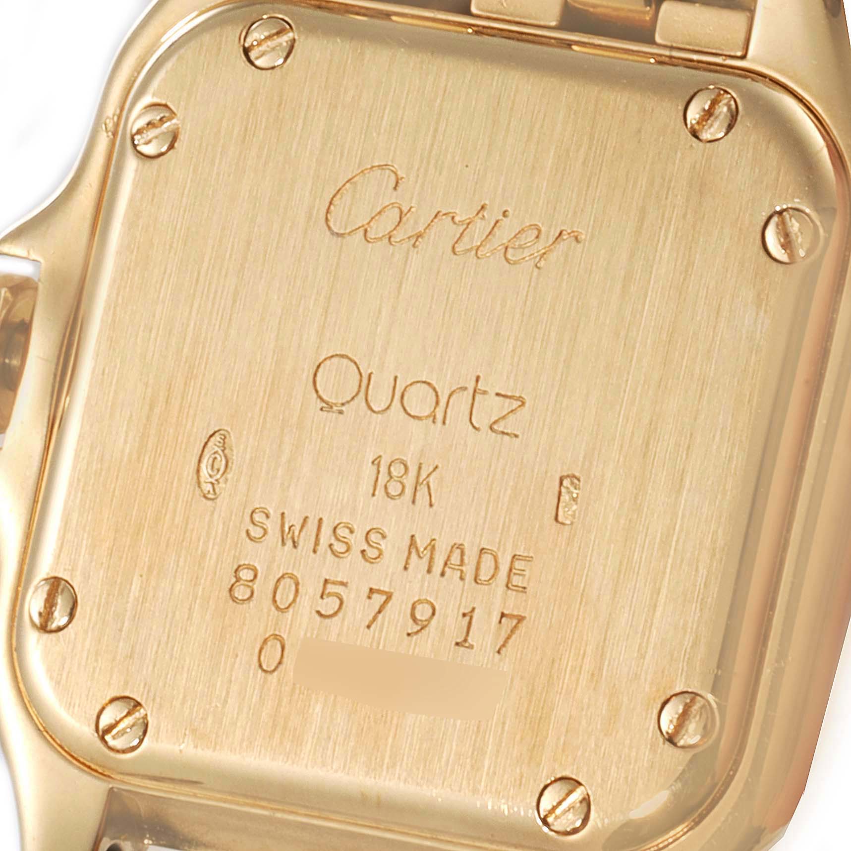 This image shows the backside of the Cartier Panthere W25022B9 Women's Yellow Gold Silver Dial W25022B9 Women's Yellow Gold Silver Dial watch, depicting its engraved details and screws.