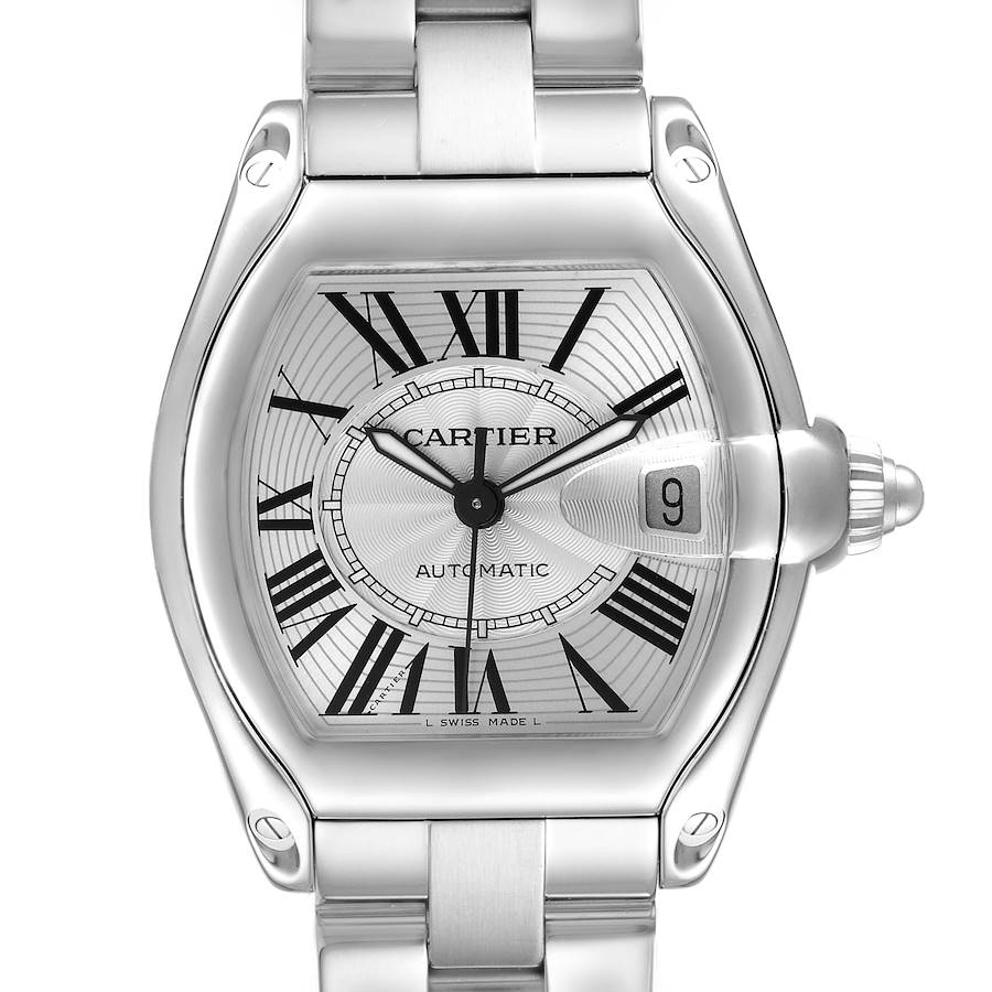 The Cartier Roadster watch is shown from the front, highlighting the face, Roman numerals, and date window.