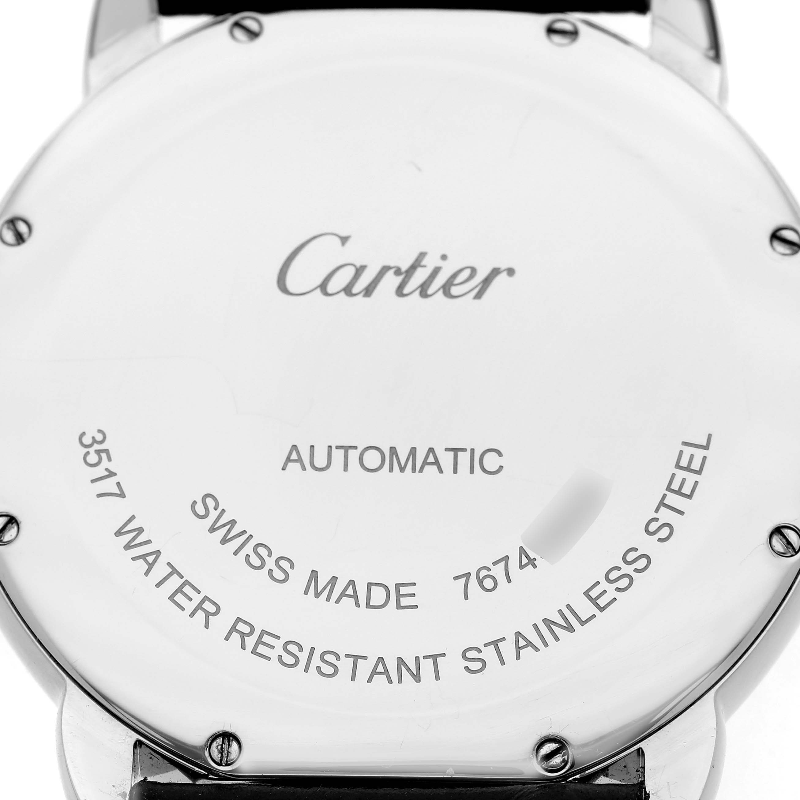 The image shows the back case of a Cartier Ronde W6701010 Men's Stainless Steel Silver Dial watch, highlighting the "Automatic" and "Swiss Made" markings.