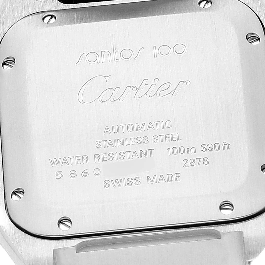 The image shows the back of a Cartier Santos W20106X8 Men's Steel and Gold (two tone) Silver Dial W20106X8 Men's Steel and Gold (two tone) Silver Dial 100 watch, featuring engravings and screws.