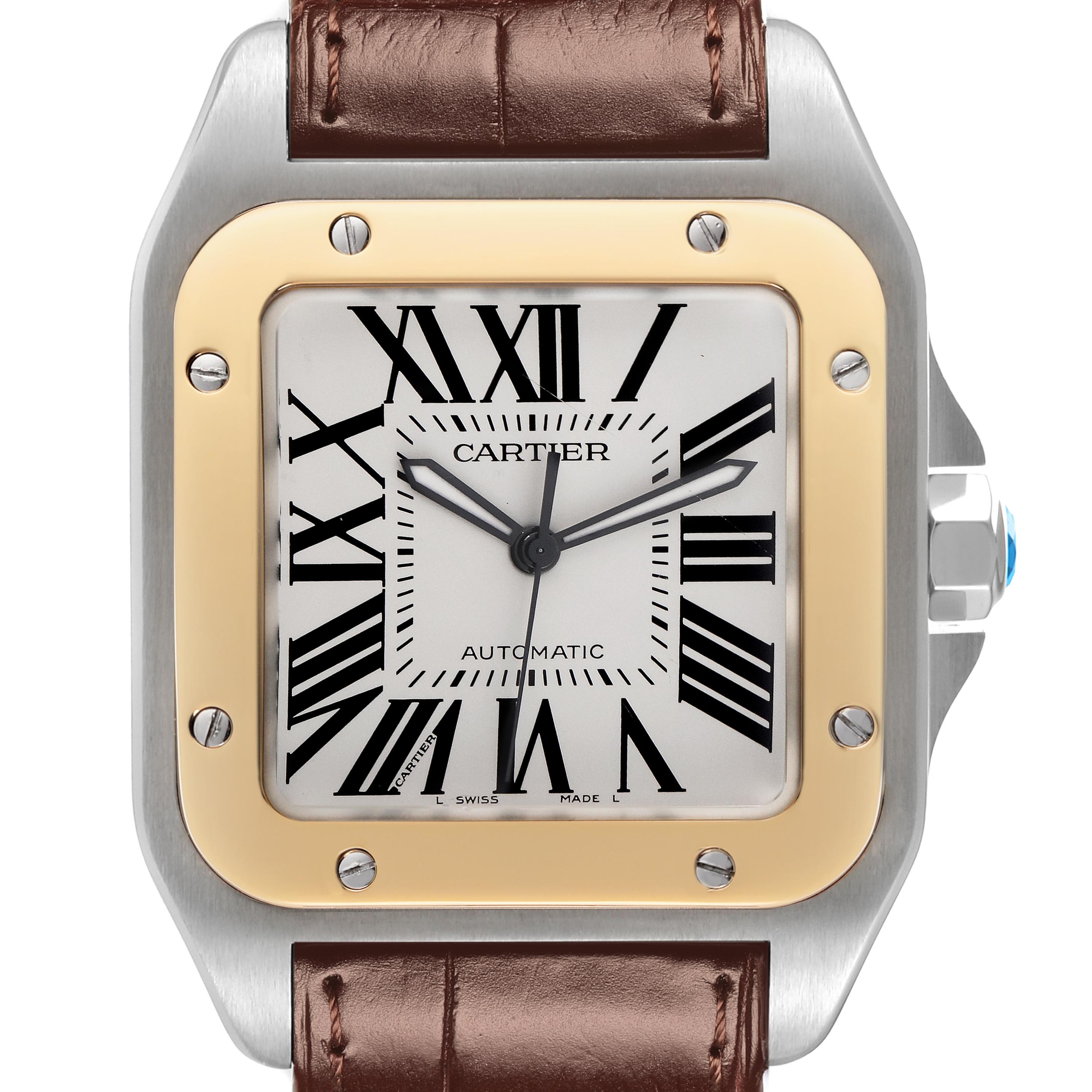 The Cartier Santos W20072X7 Men's Steel and Gold (two tone) Silver Dial W20072X7 Men's Steel and Gold (two tone) Silver Dial watch is shown from a front angle, displaying its face, bezel, and part of the brown leather strap.