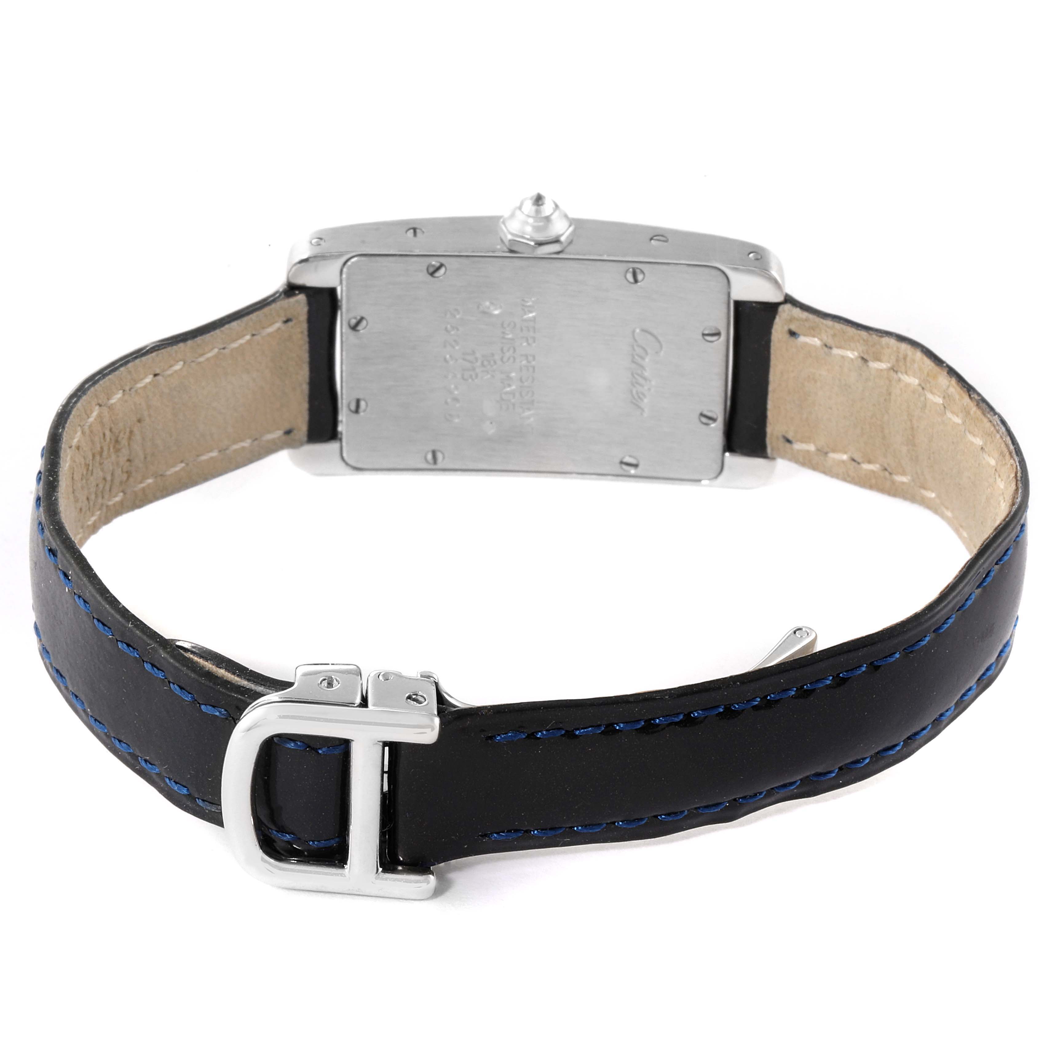 The image shows the back and leather strap of the Cartier Tank Américaine watch, including the clasp and case back.