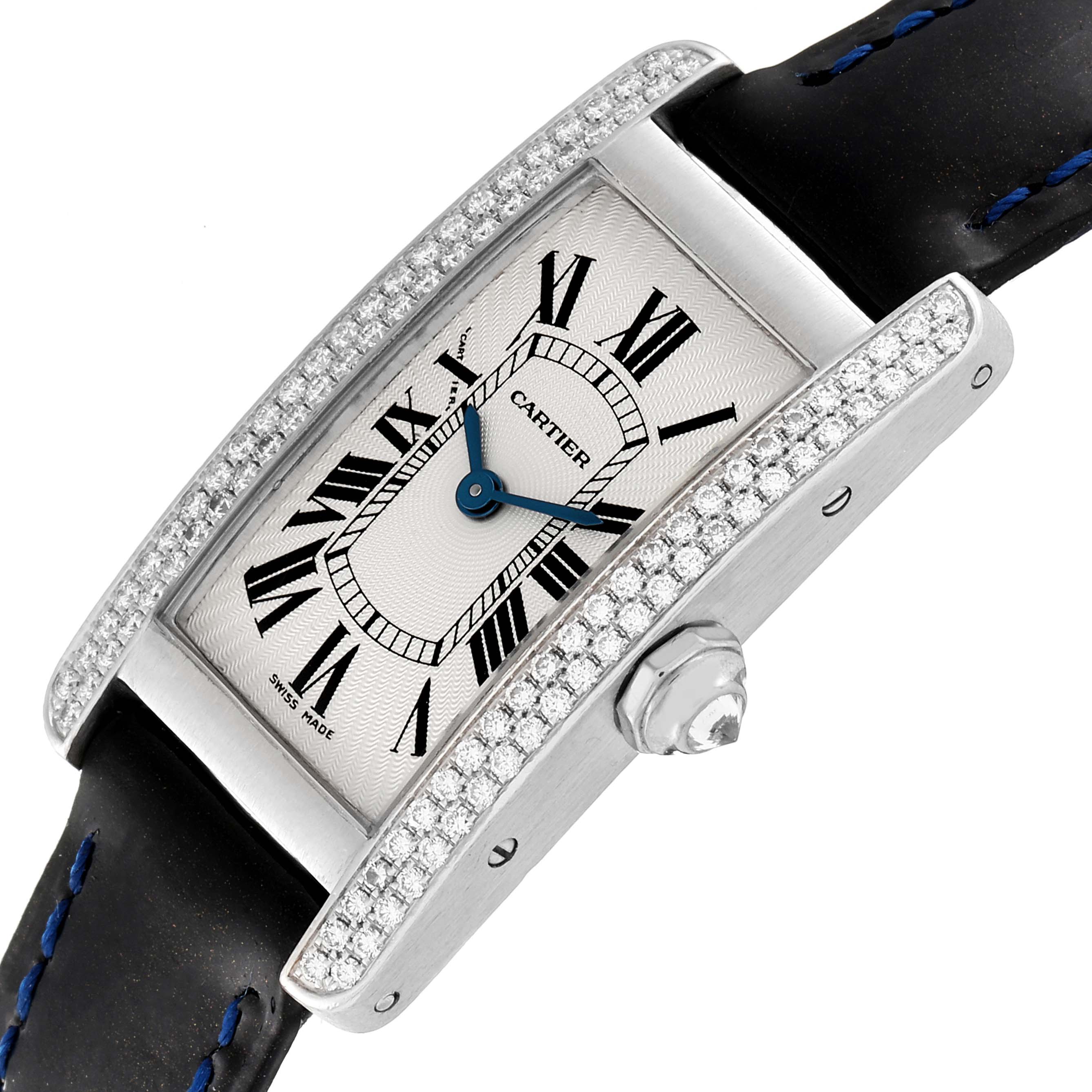 The image shows a Cartier Tank Americaine WB701851 Women's White Gold Silver Dial WB701851 Women's White Gold Silver Dial watch at an angled view, highlighting its dial, bezel adorned with diamonds, and strap.