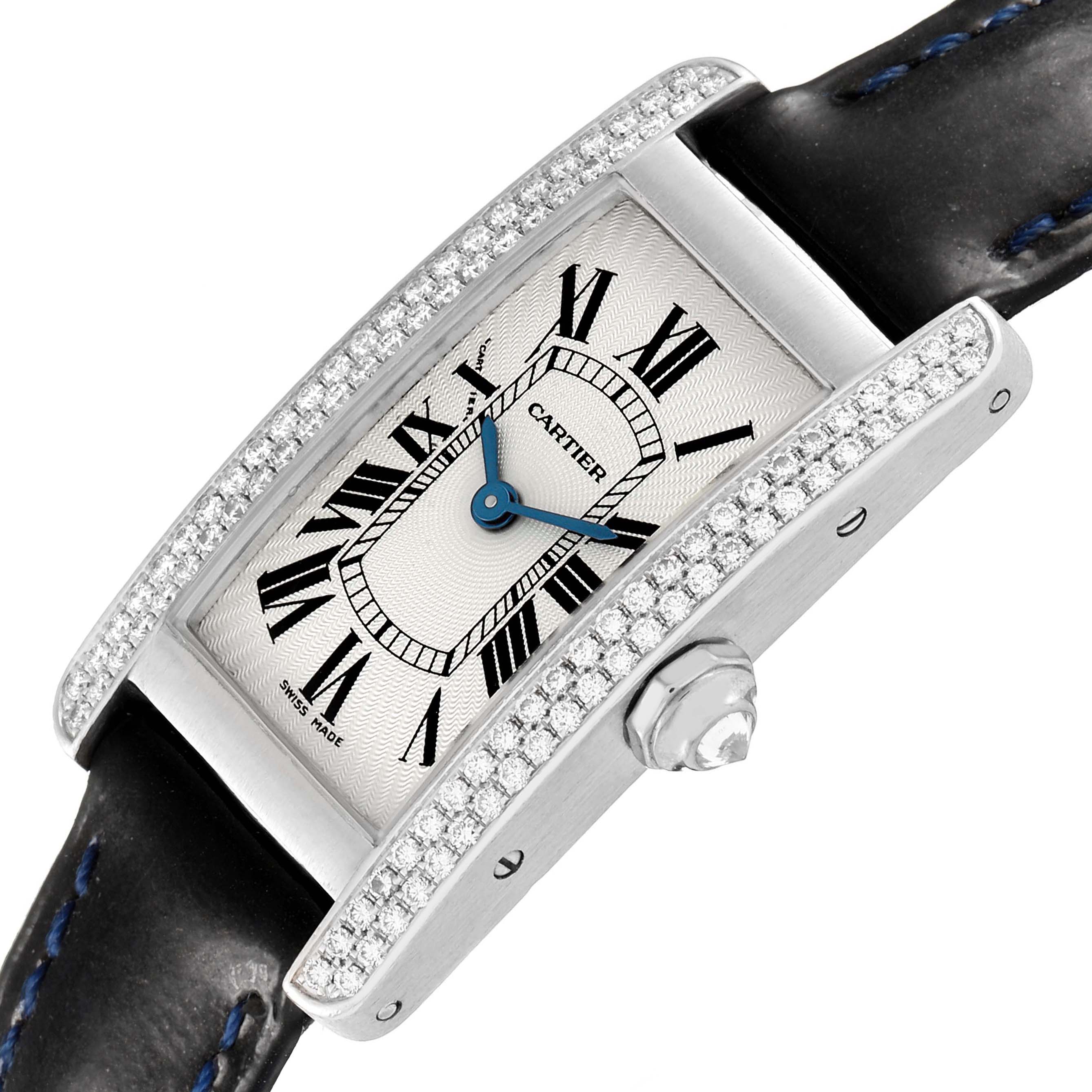 The Cartier Tank Americaine WB701851 Women's White Gold Silver Dial watch is shown at an angled view, highlighting its diamond-set bezel, dial, and crown.